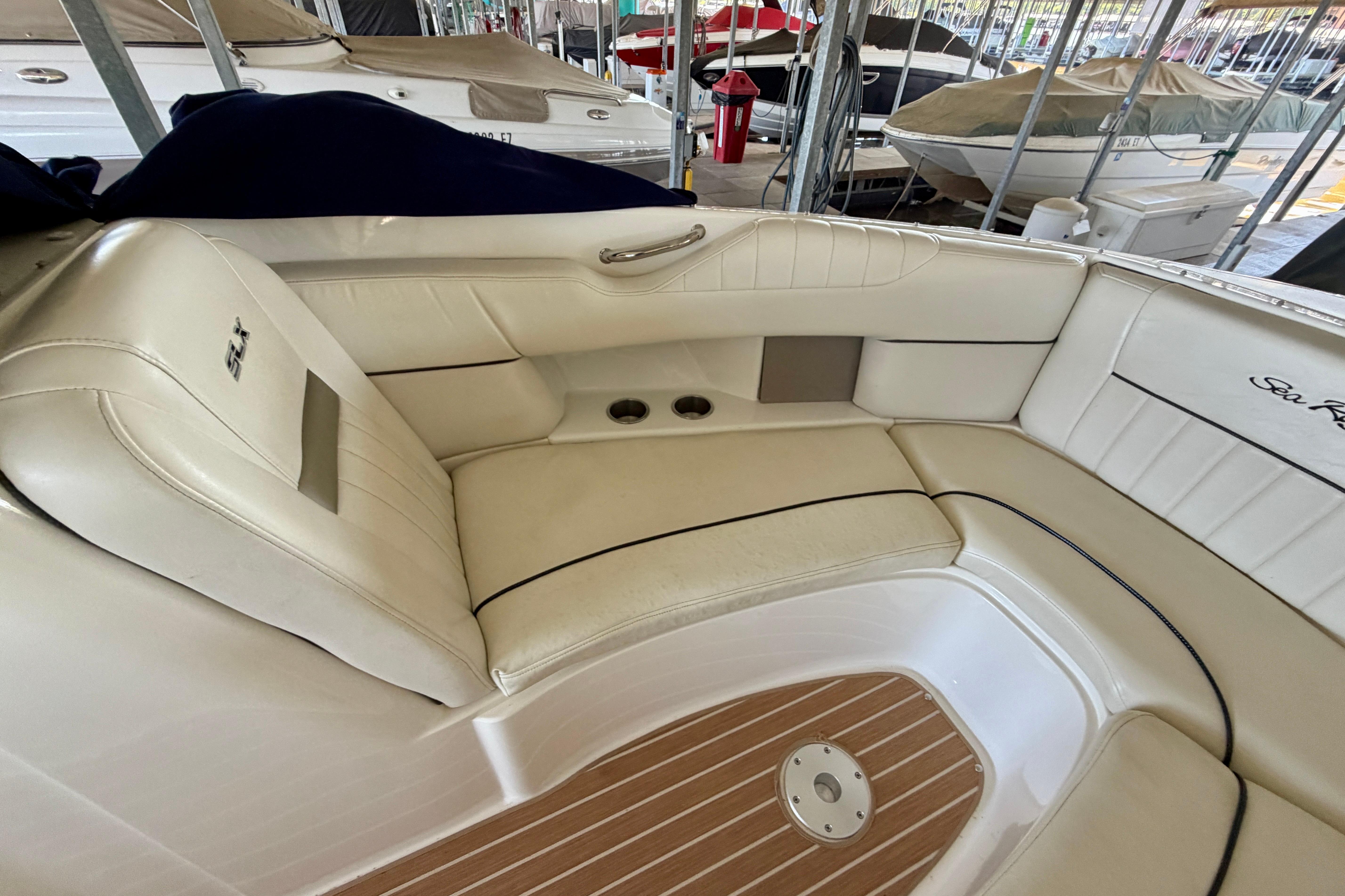 Luxurious interior of a 2007 Sea Ray 270 SLX boat with cream leather seating.