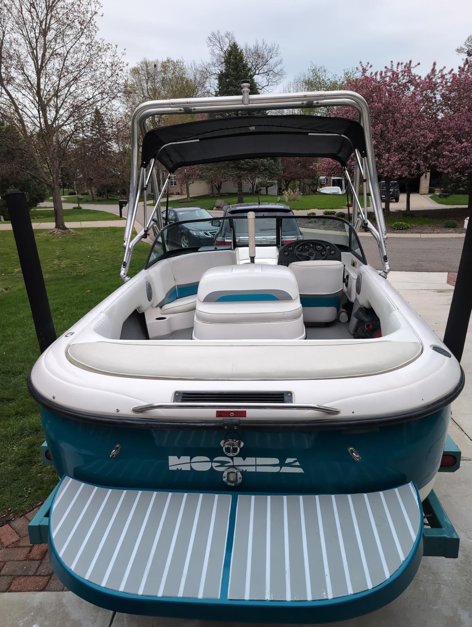 2000 Moomba Outback LS with blue and white interior, parked on a trailer.