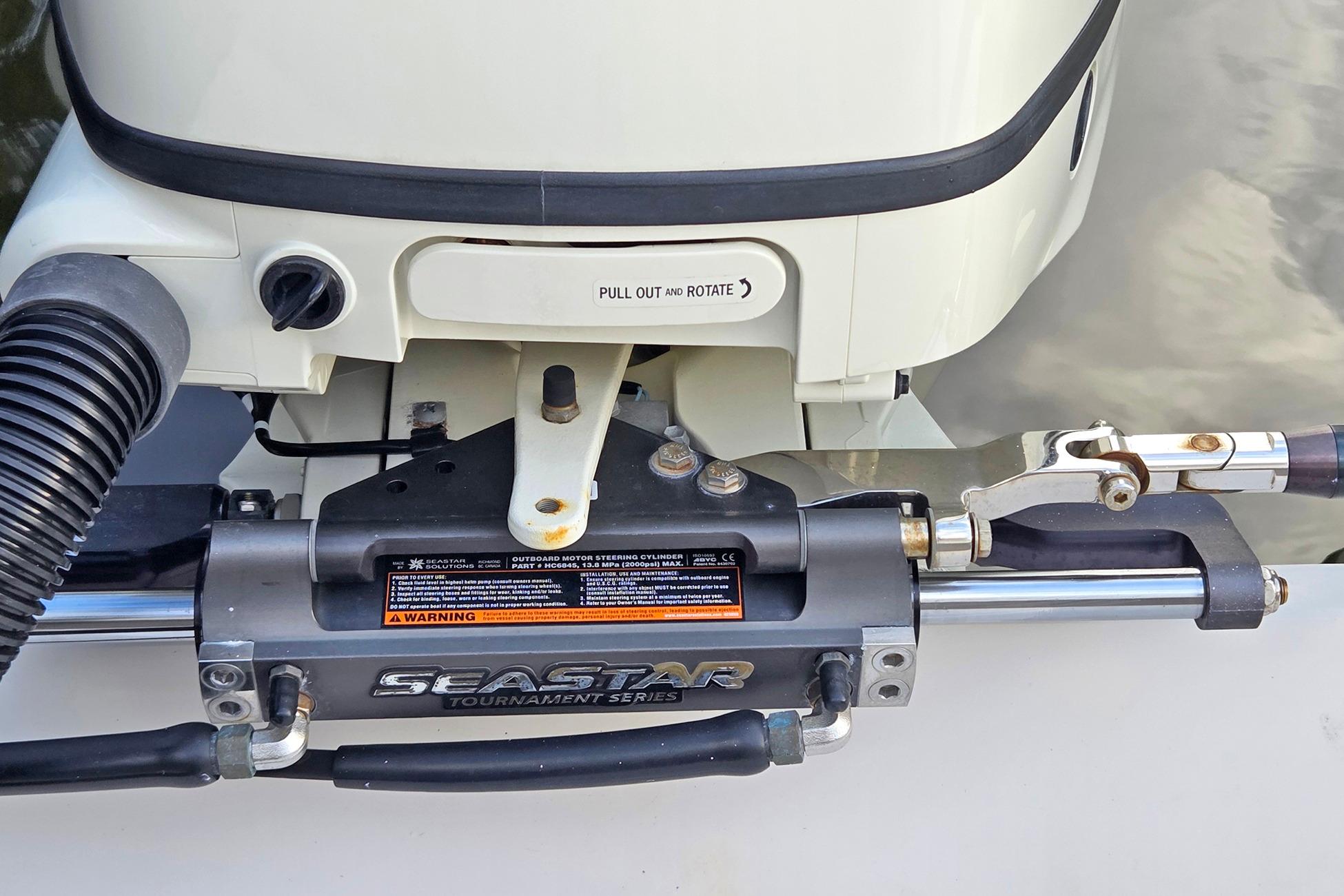 Close-up of a 2001 Jupiter 31 Cuddy boat's SeaStar steering system.