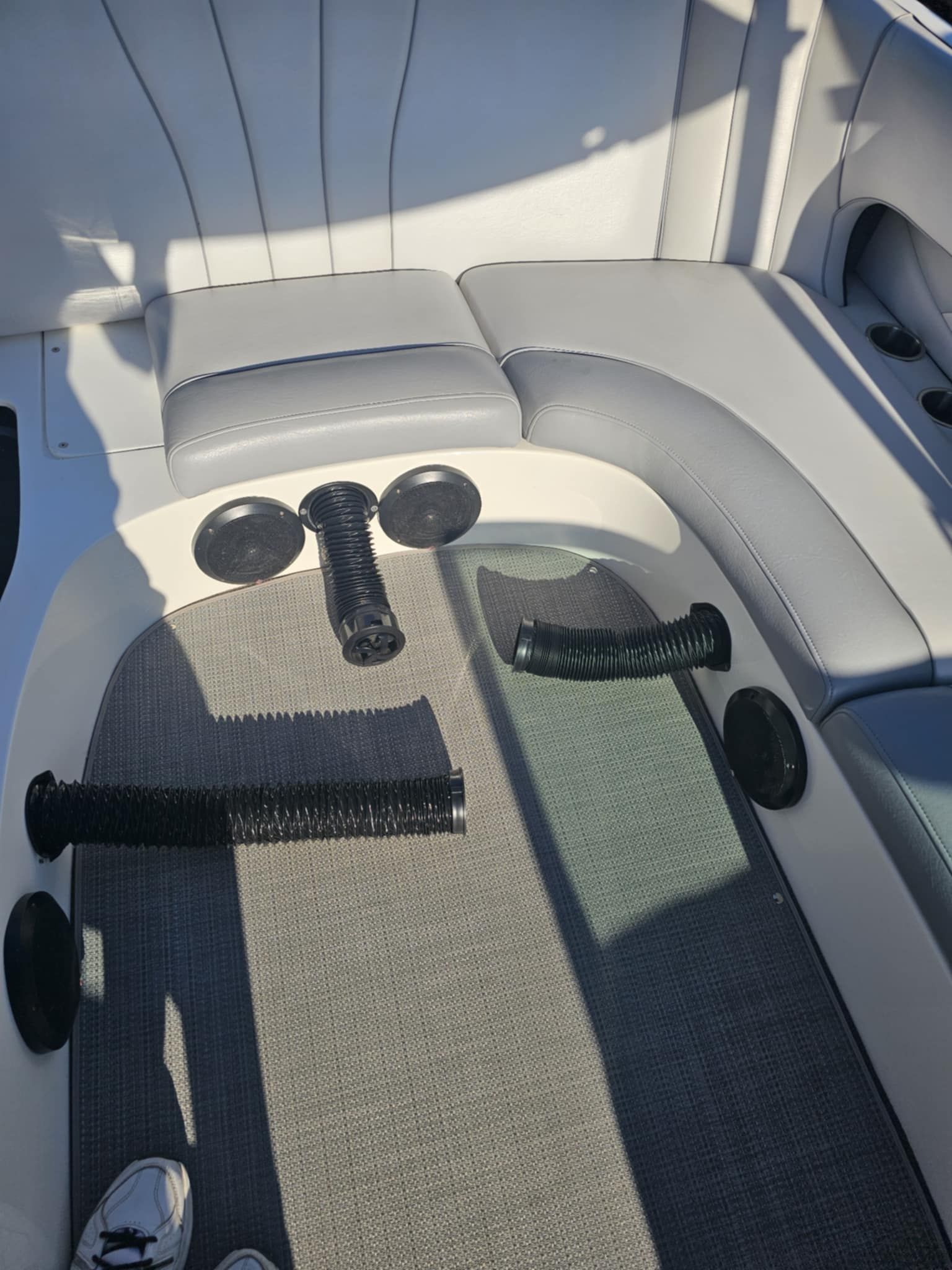 Interior of a 2006 MB PIGPR with gray seats and black hoses.