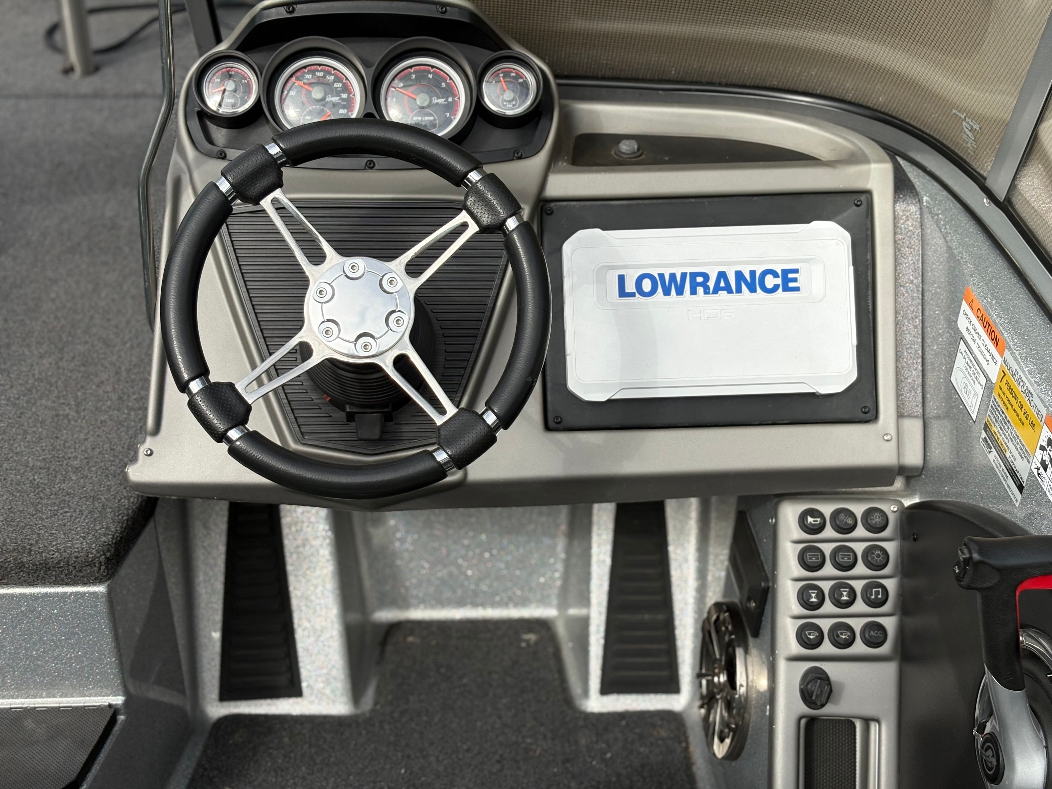 The image shows the cockpit of a 2019 Ranger 1880MS Angler with steering wheel and instruments.