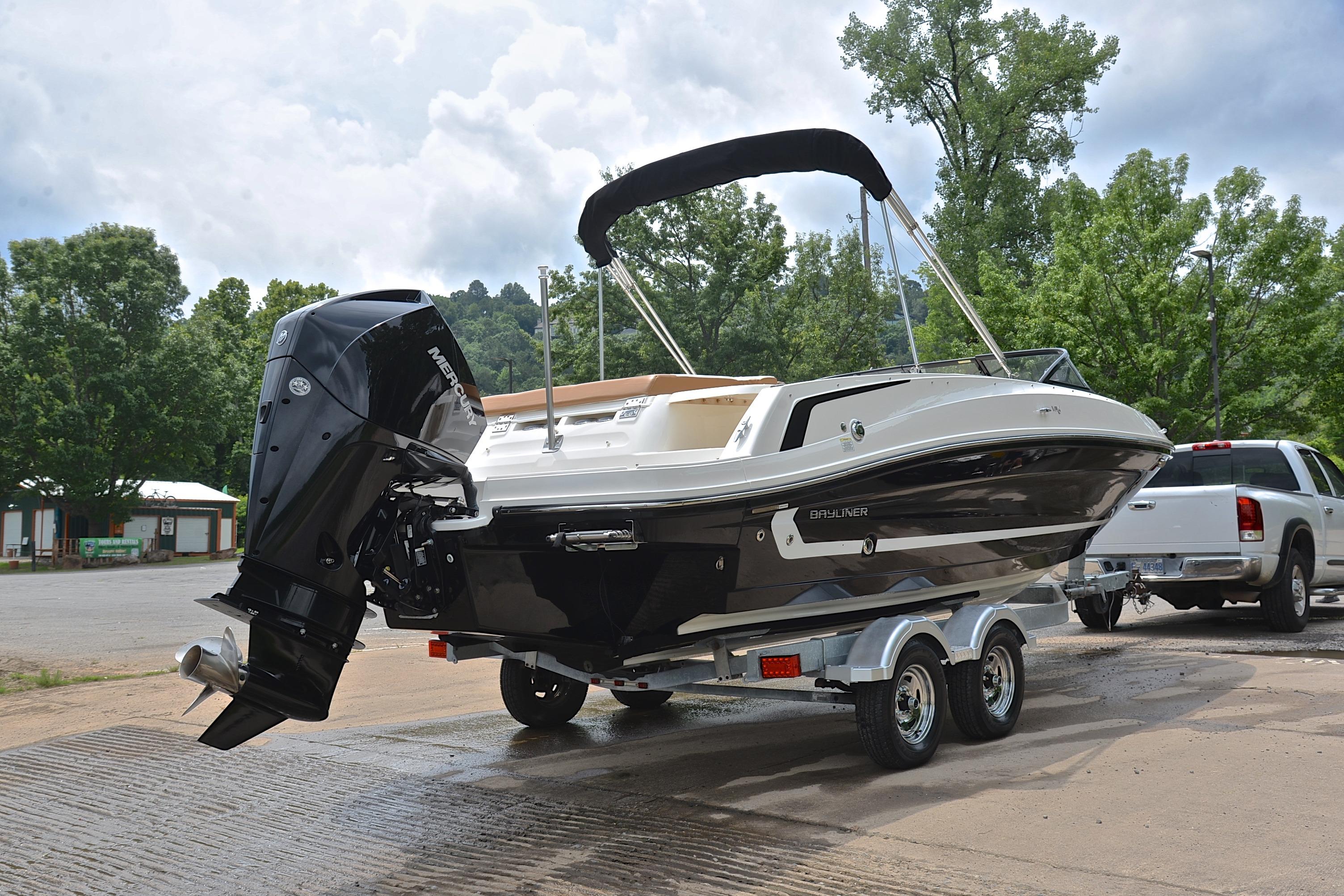 2019 Bayliner VR6 Bowrider OB on trailer, parked outdoors near trees.