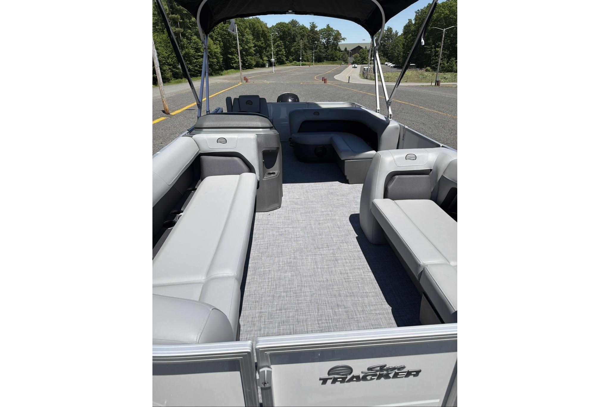 2026 Sun Tracker Party Barge 18 DLX interior with spacious seating and canopy.