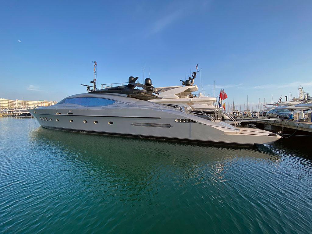 Luxurious 2005 Palmer Johnson 120 yacht docked in a serene marina setting.