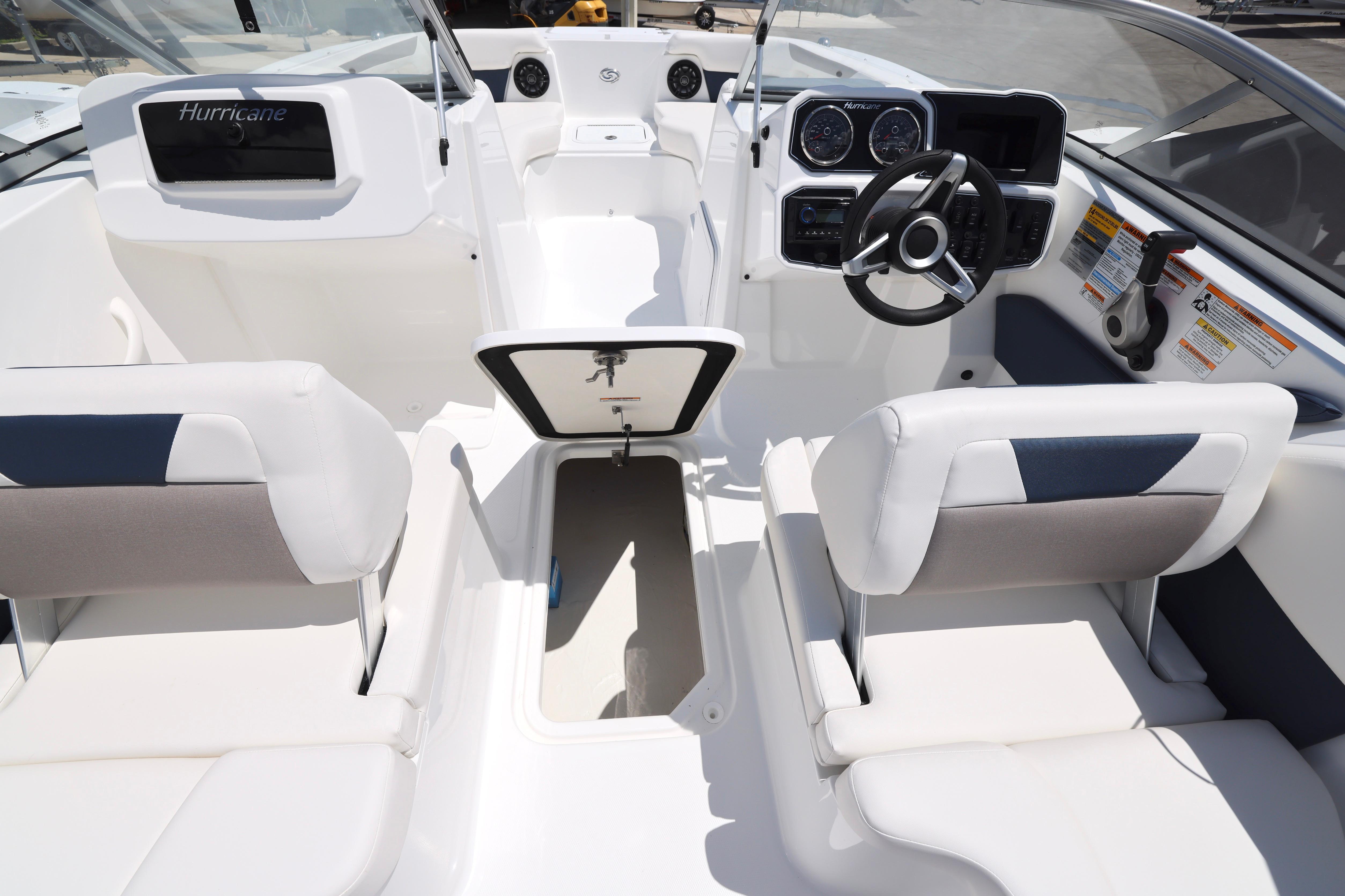 2026 Hurricane SunDeck 2050 OB boat interior with modern dashboard and seating.