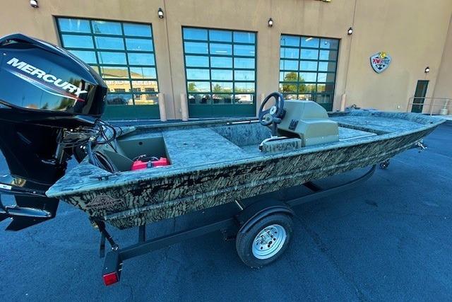 2026 Tracker Grizzly 1648 SC boat with Mercury engine on trailer.