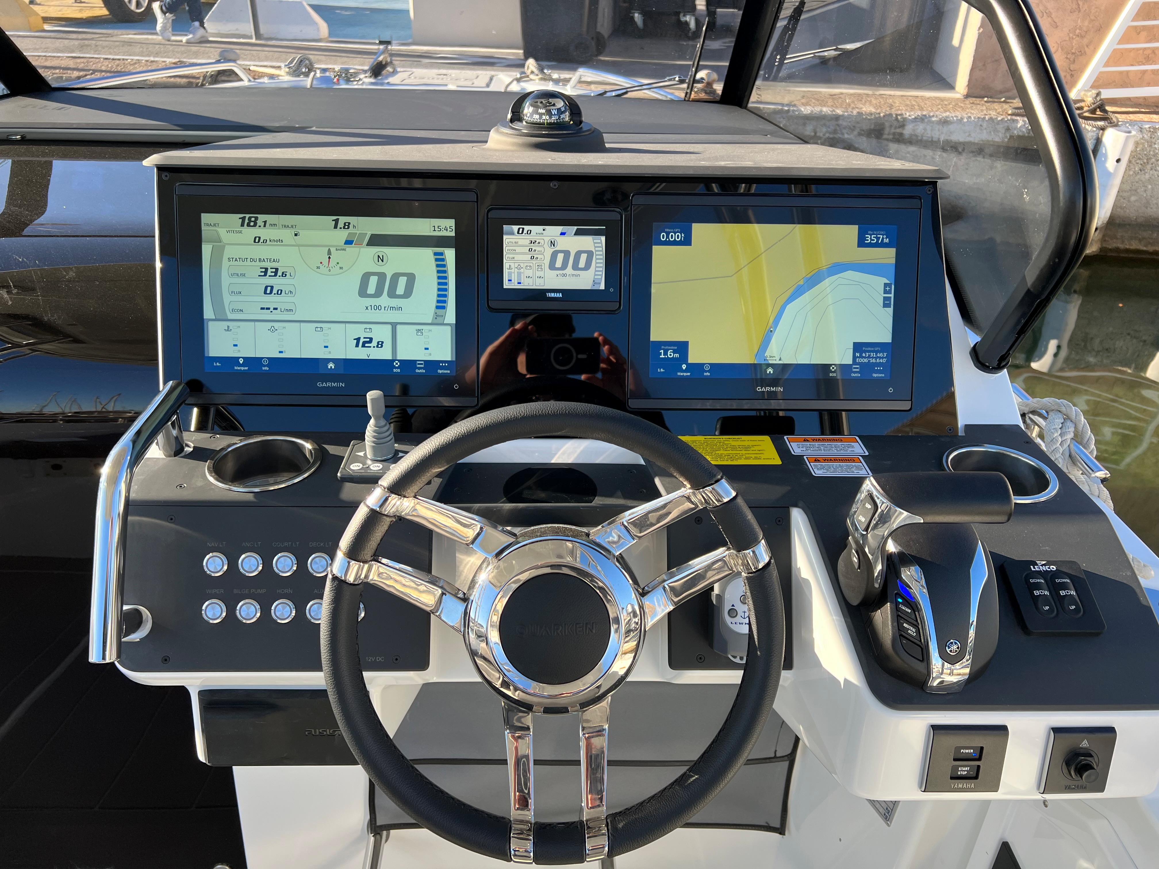 2025 Quarken 27 T-Top boat dashboard with modern navigation screens and controls.