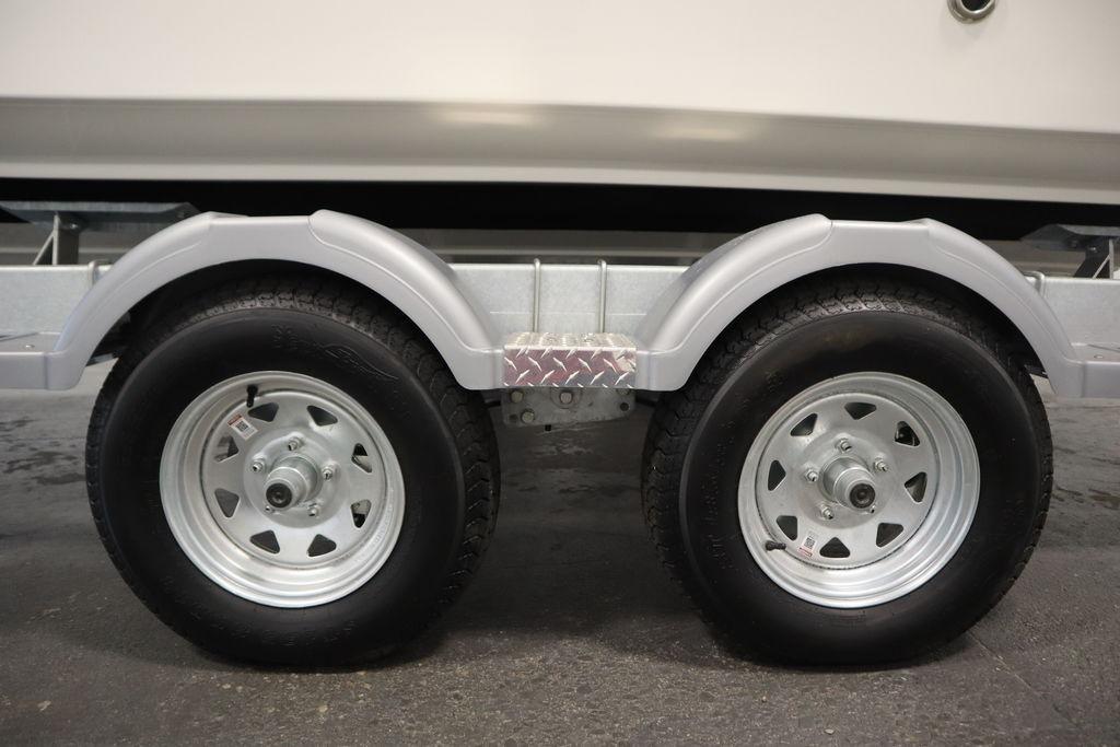 Trailer wheels for 2026 Bayliner Trophy T20CC boat, featuring dual axles.