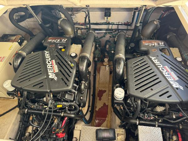 Twin Mercury engines in a 2004 Sea Ray 390 Sundancer boat engine room.