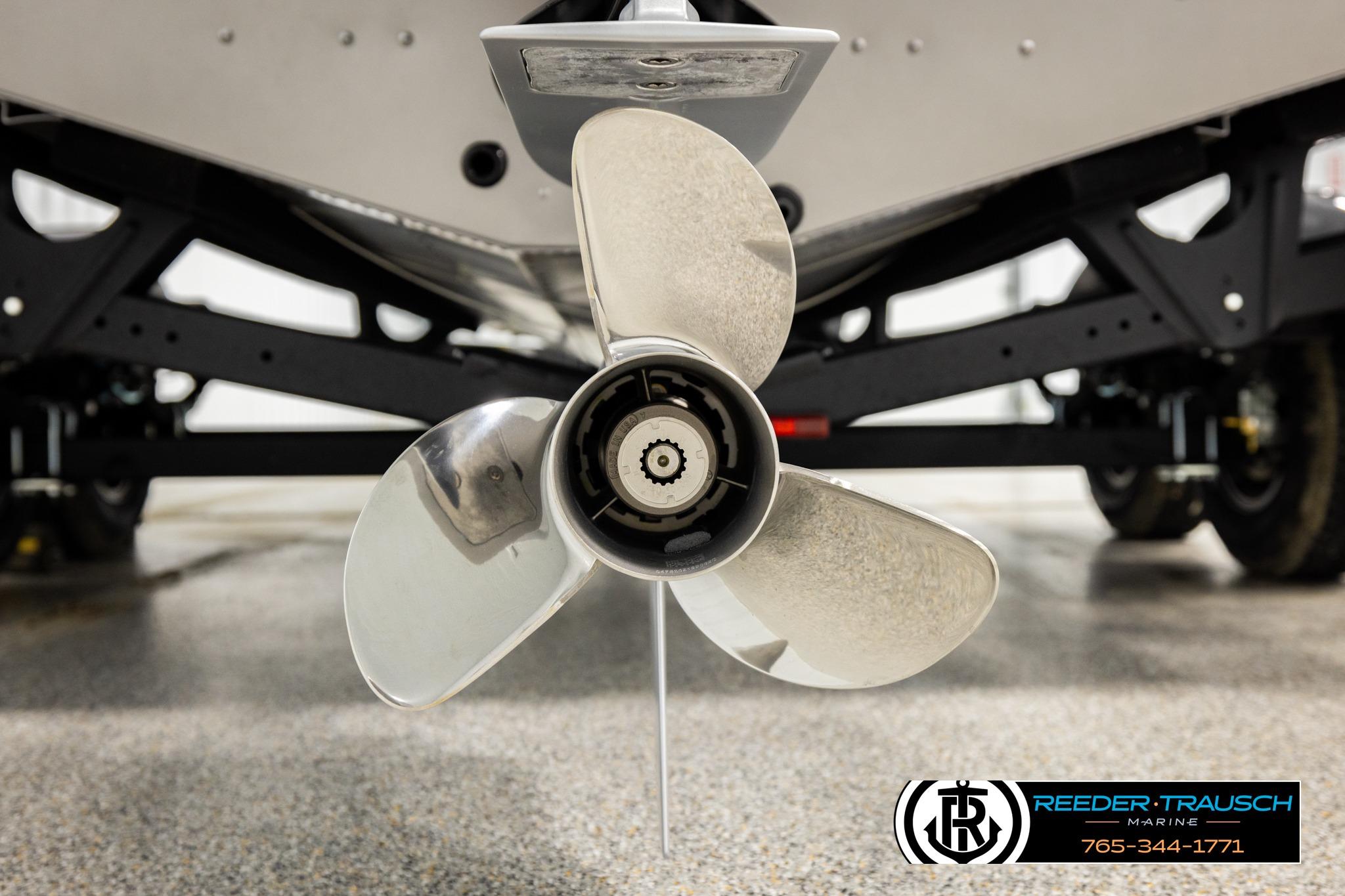 Close-up of a 2026 Lund 1975 Tyee boat propeller on a trailer.