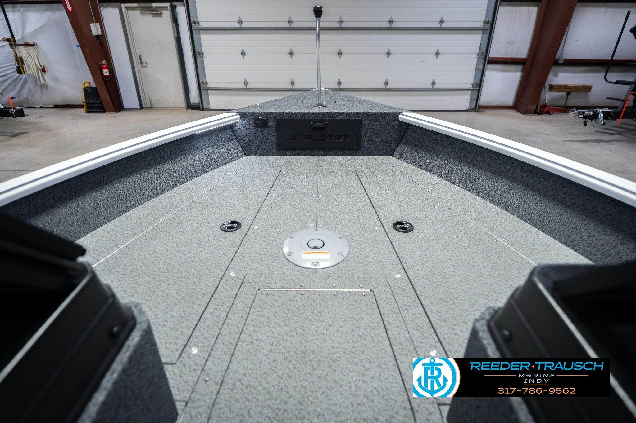 2026 Lund 1700 Explorer Sport boat interior in a garage setting.