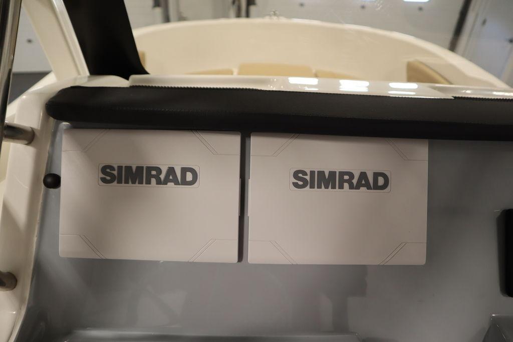 Simrad electronics on 2026 Bayliner Trophy T20CC dashboard, showcasing advanced marine technology.