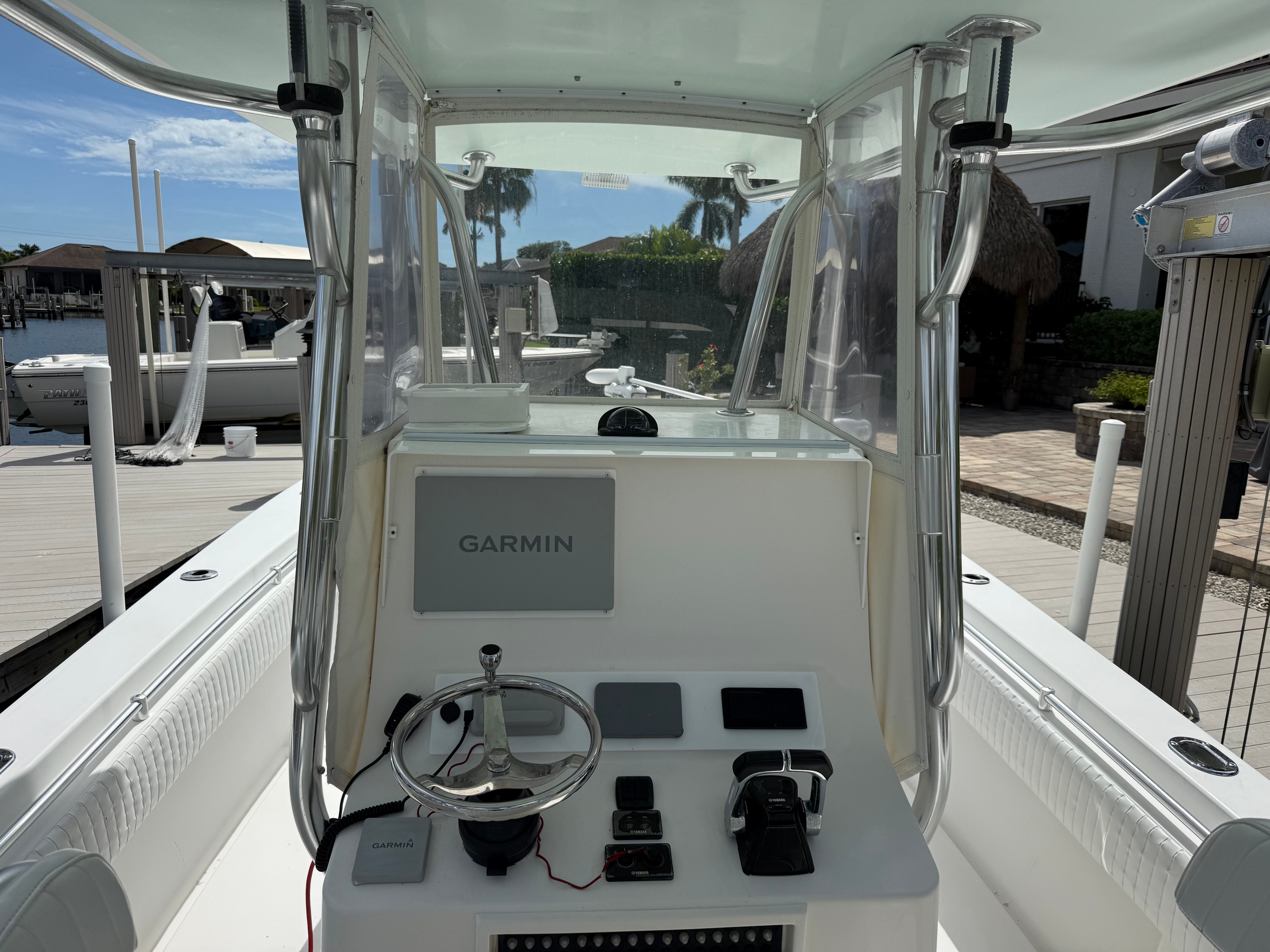 Interior view of a 2012 Contender 32 ST boat with Garmin controls.
