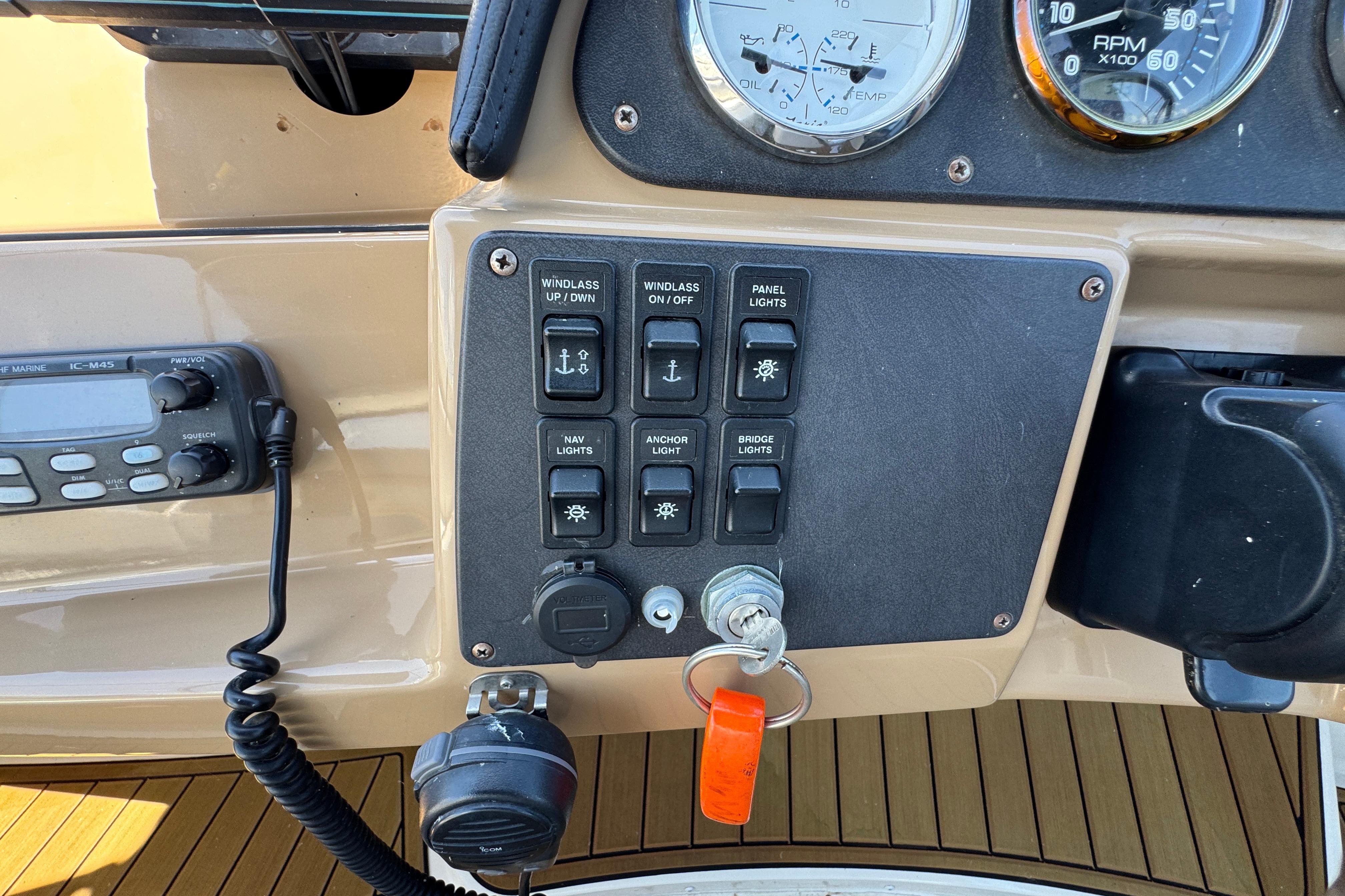Control panel of a 2002 Carver 396 Motor Yacht with switches and gauges.