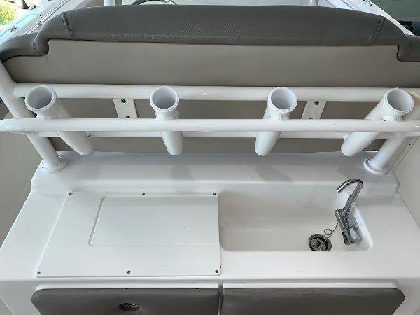 2024 Key West 263 FS boat with rod holders and sink.