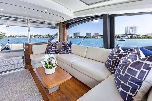 Luxurious 2020 Princess V55 yacht interior with elegant seating and scenic ocean views.