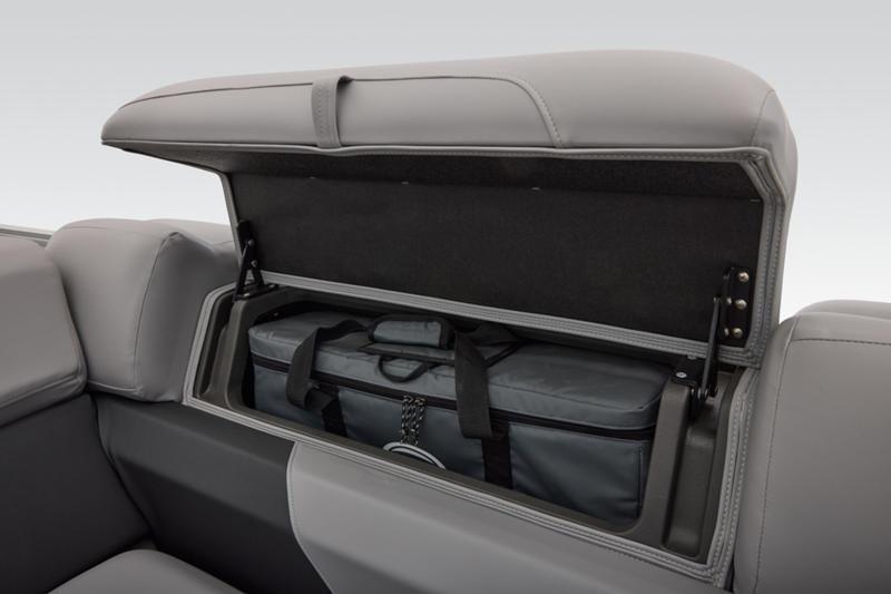 2026 Sun Tracker Party Barge 22 DLX storage compartment with gray interior and bag.