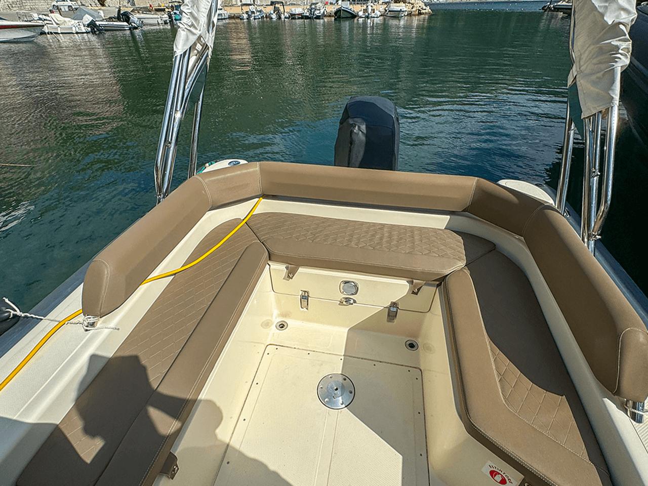 BSC 78 boat interior with tan seating, docked in a marina, 2019 model.