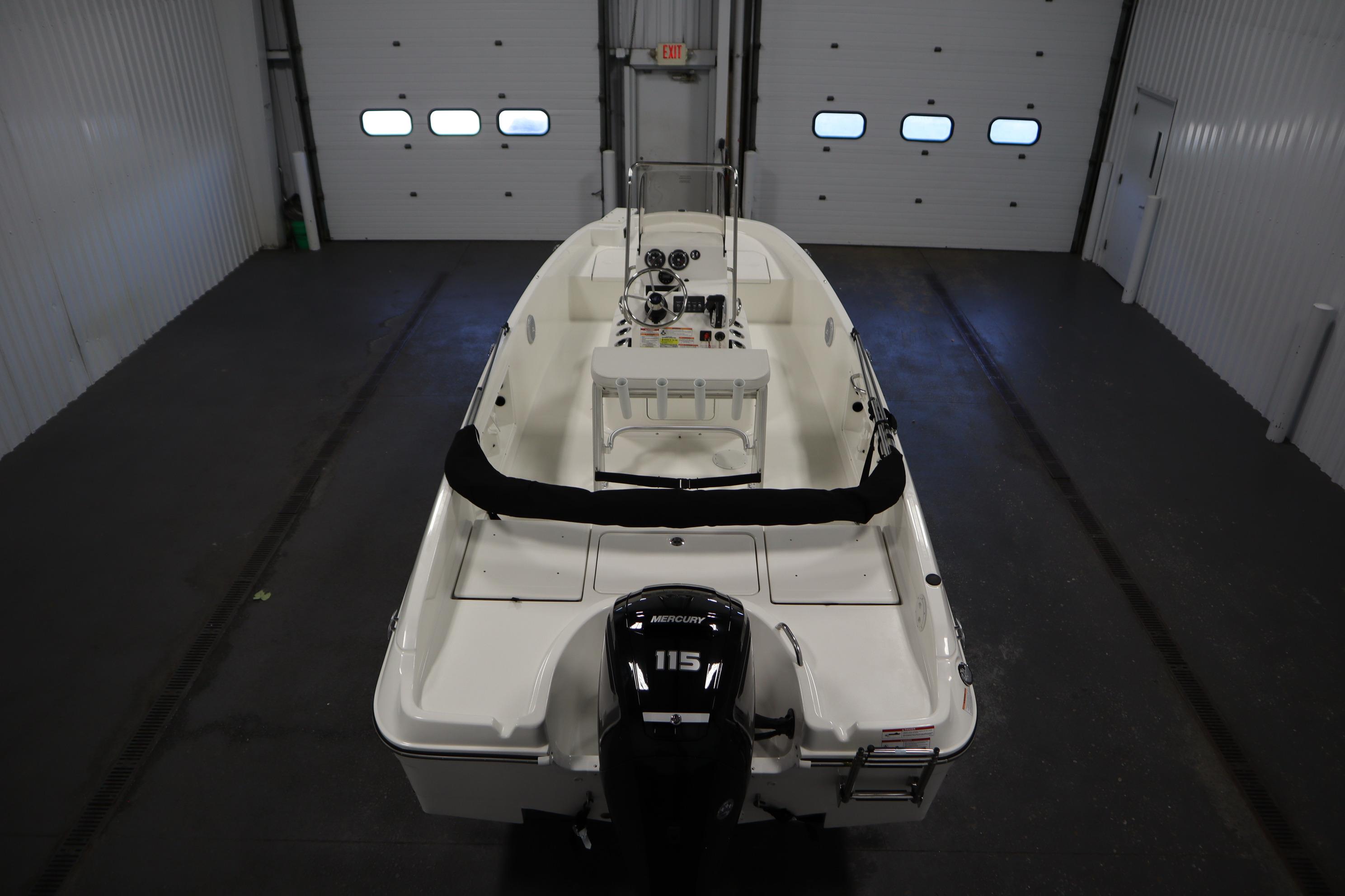 2026 Bayliner Trophy T18 boat in indoor storage, featuring a Mercury 115 outboard motor.
