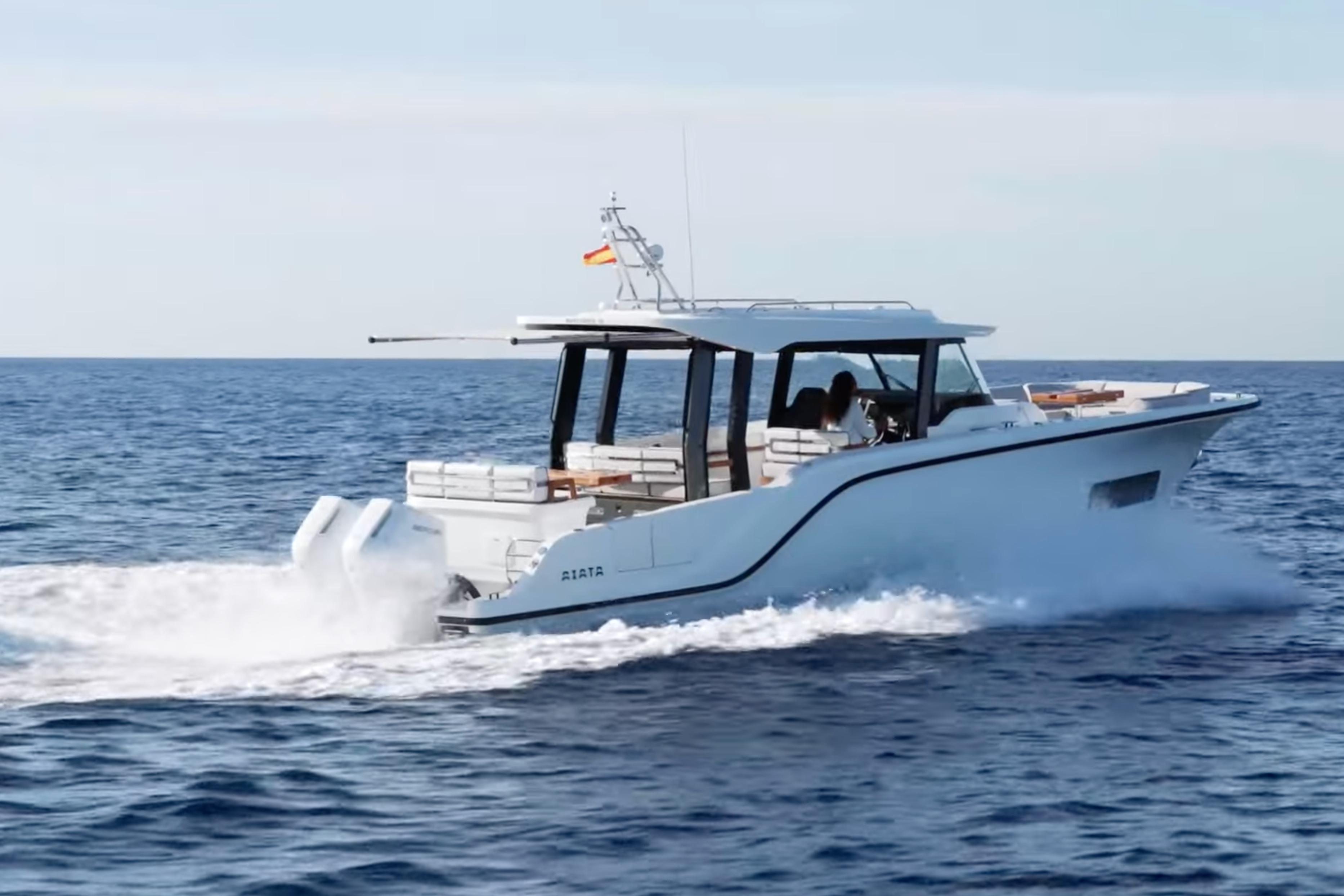 2026 Aiata Wayfinder 38 Suntop cruising on open sea, showcasing sleek design and powerful engines.