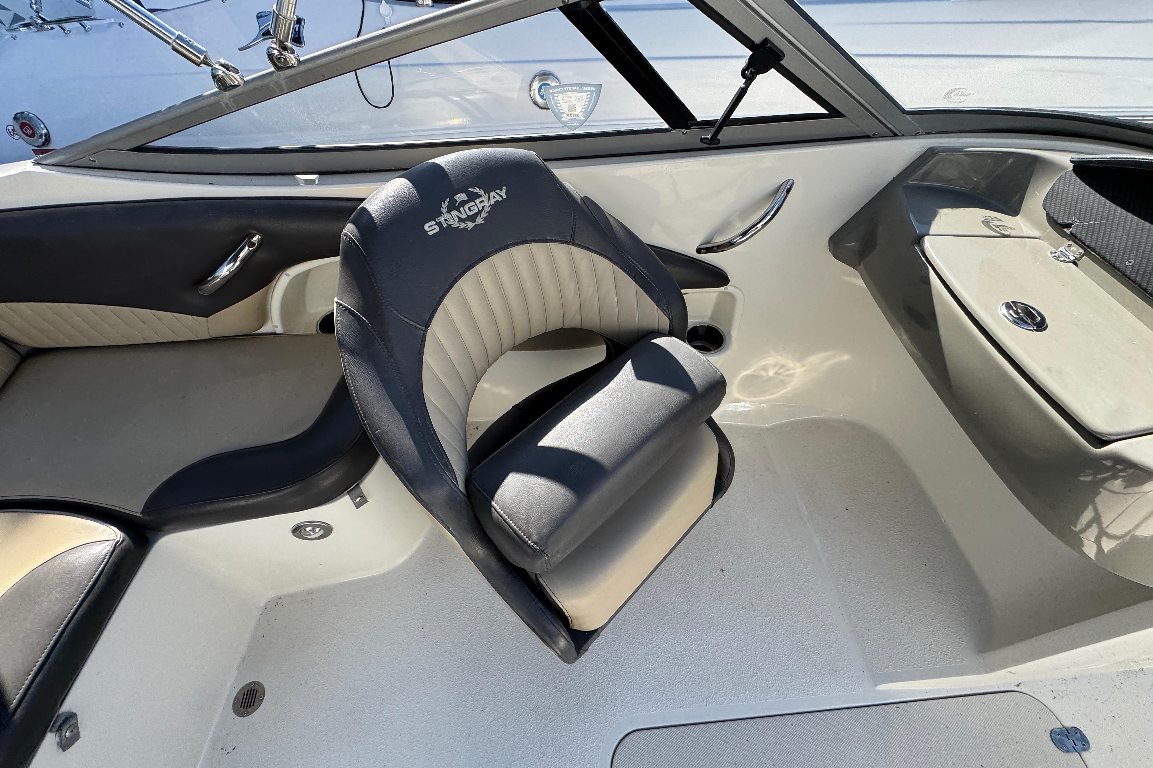 Interior of a 2018 Stingray 204 LR boat featuring a stylish captain's chair.