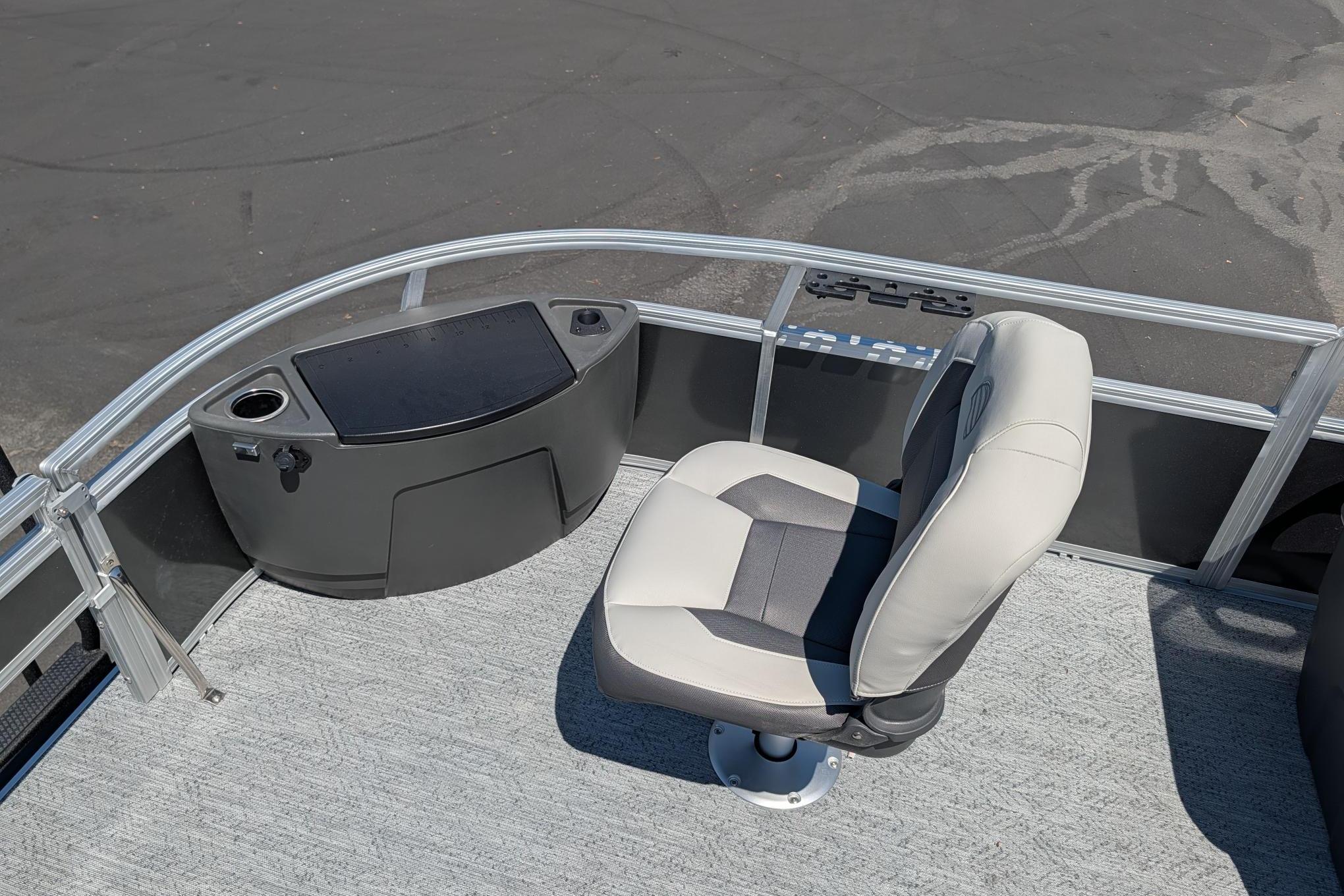 2026 Sun Tracker Bass Buggy 18 DLX boat interior with swivel seat and console.