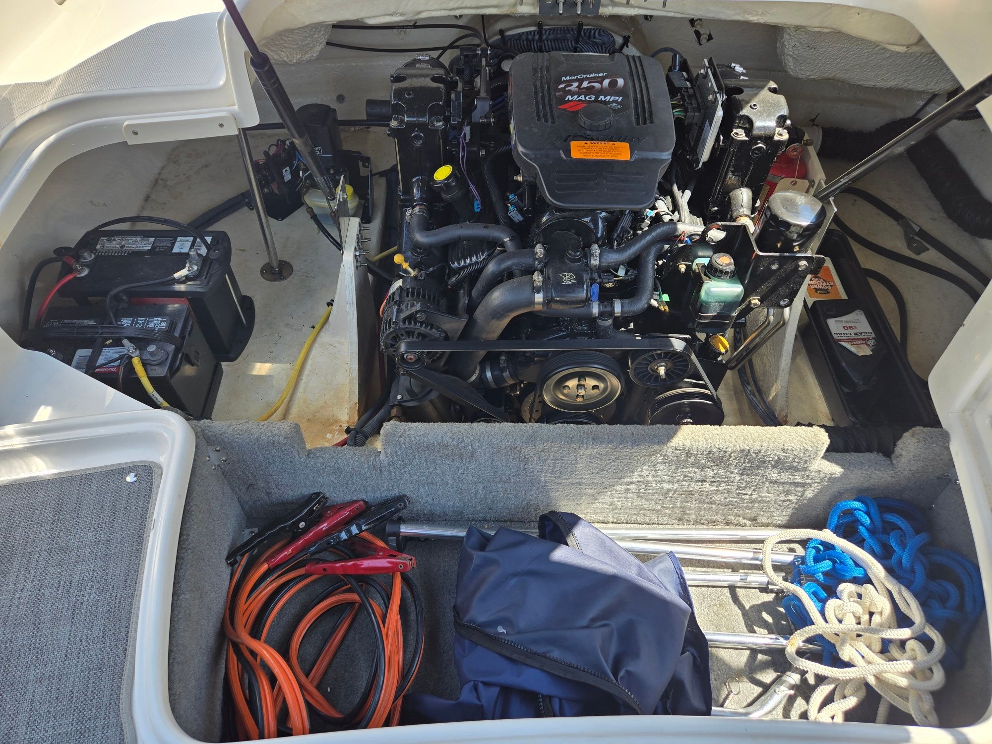 An open engine compartment of a 2005 Chaparral 220 SSi with a 250 HP engine.