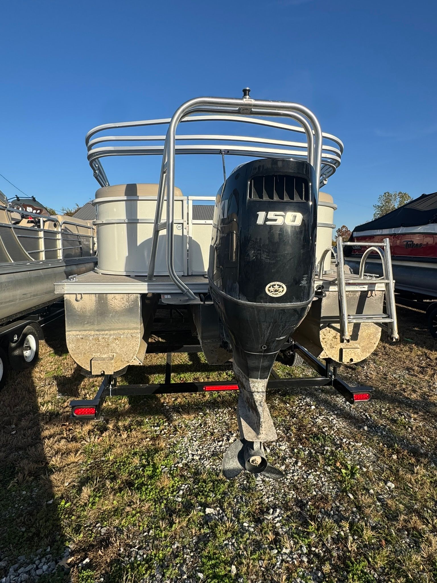 2024 Landau Island Breeze 252 pontoon boat with outboard motor.
