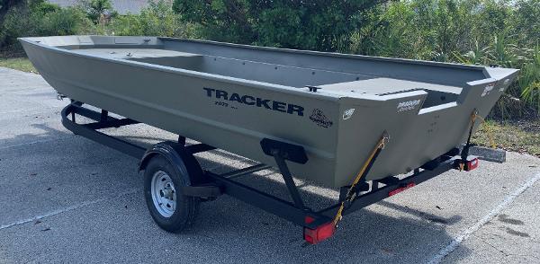 2025 Tracker GRIZZLY 2072 Utility boat on trailer in outdoor setting.