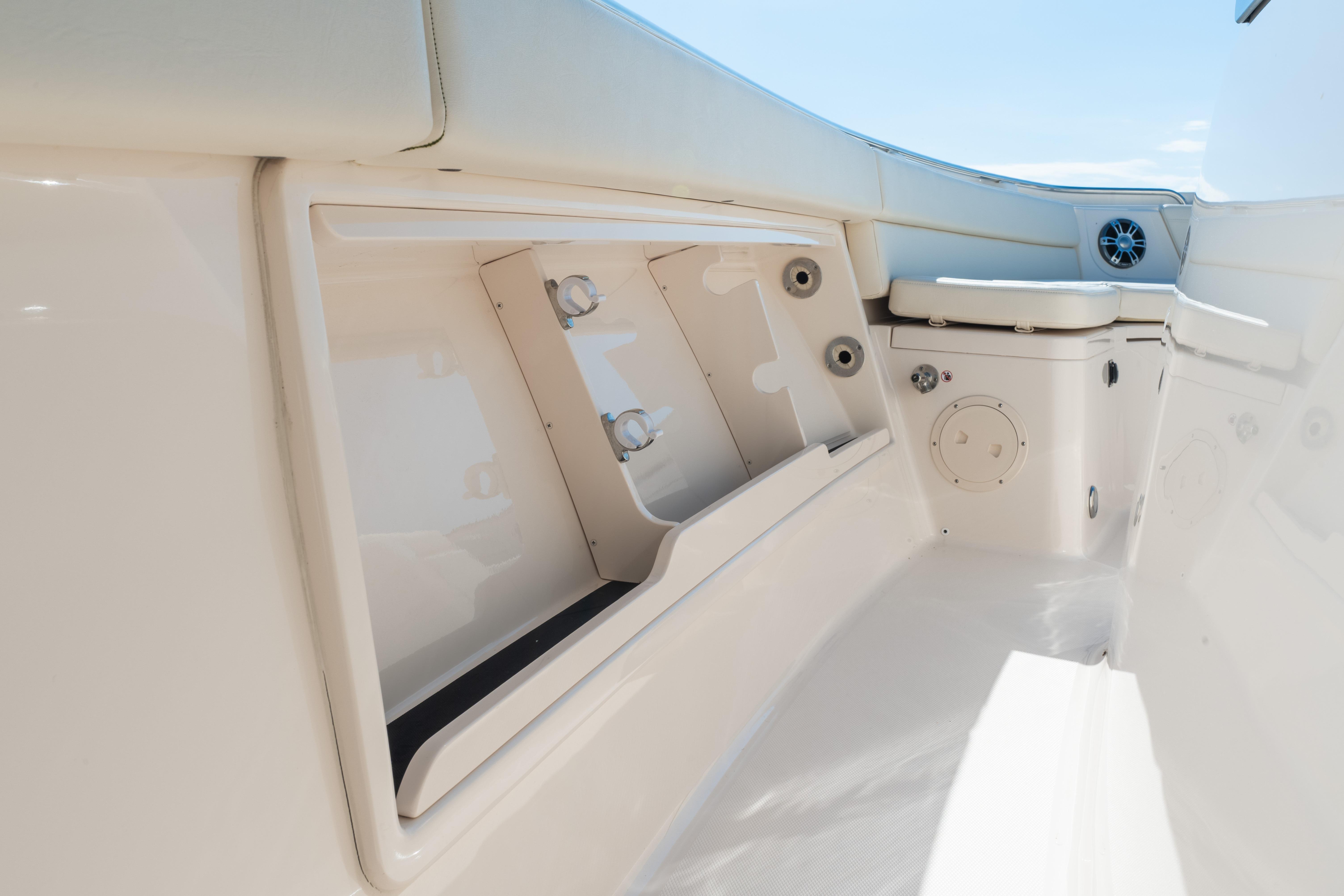 Interior view of 2025 Grady-White Canyon 386 boat, featuring storage compartments and seating.