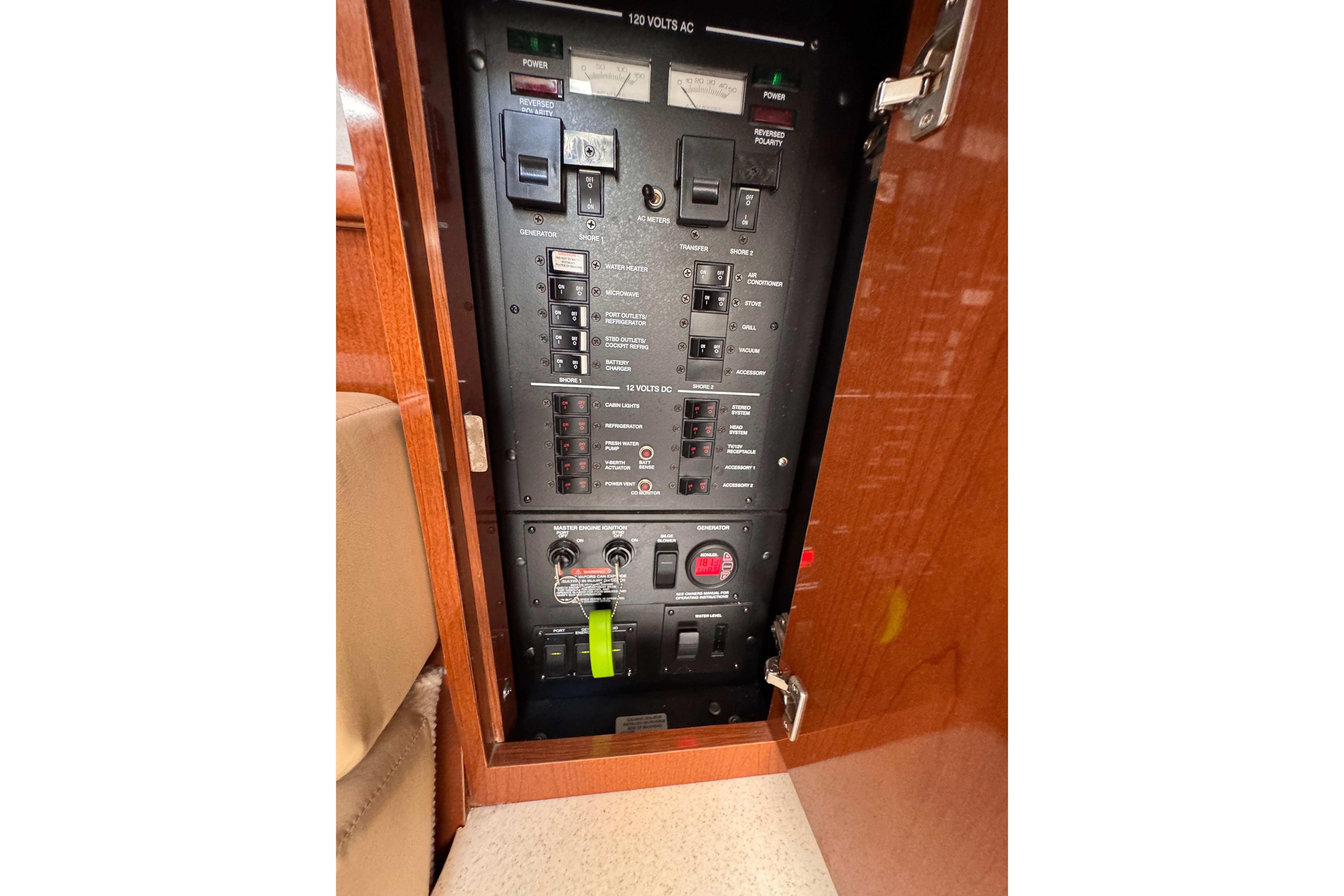 Electrical panel inside a 2008 Sea Ray Sundancer 350 yacht, showcasing circuit breakers and controls.