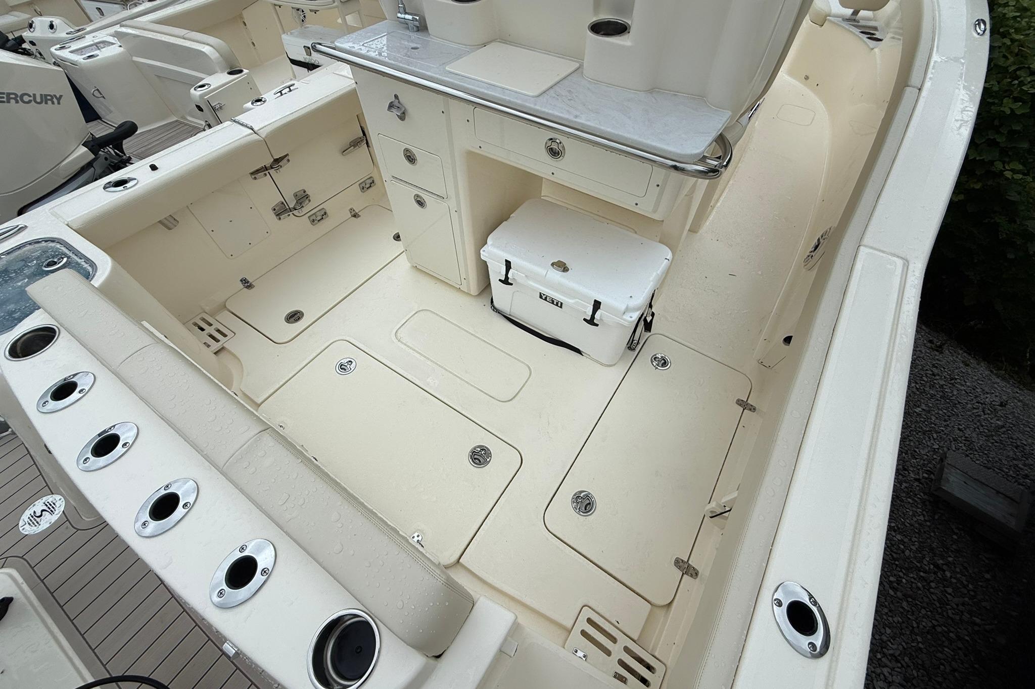 2026 Scout 260 LXF boat interior with storage compartments and seating area.