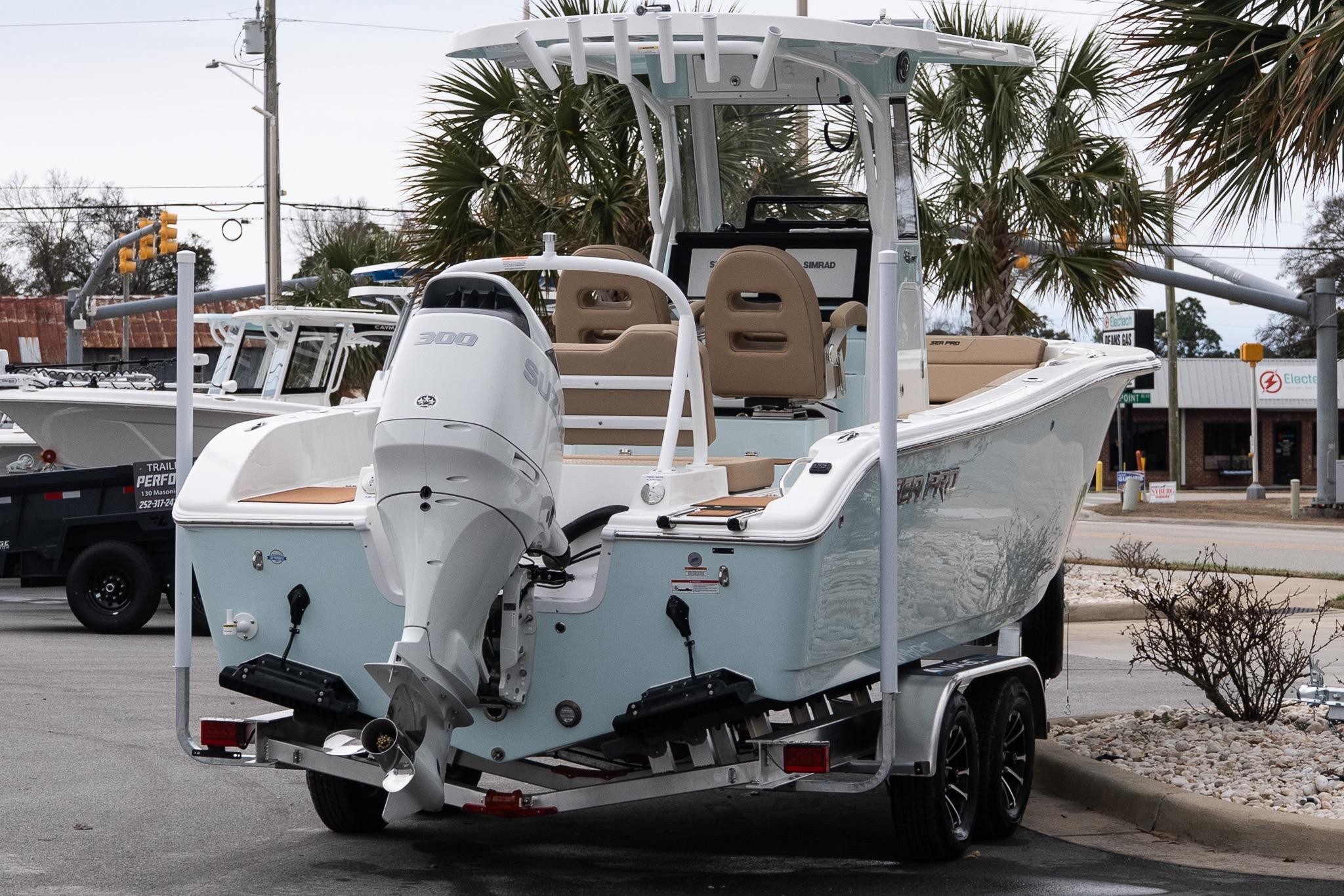2026 Sea Pro 245FLXR Sandbar boat on trailer, featuring a powerful outboard motor.