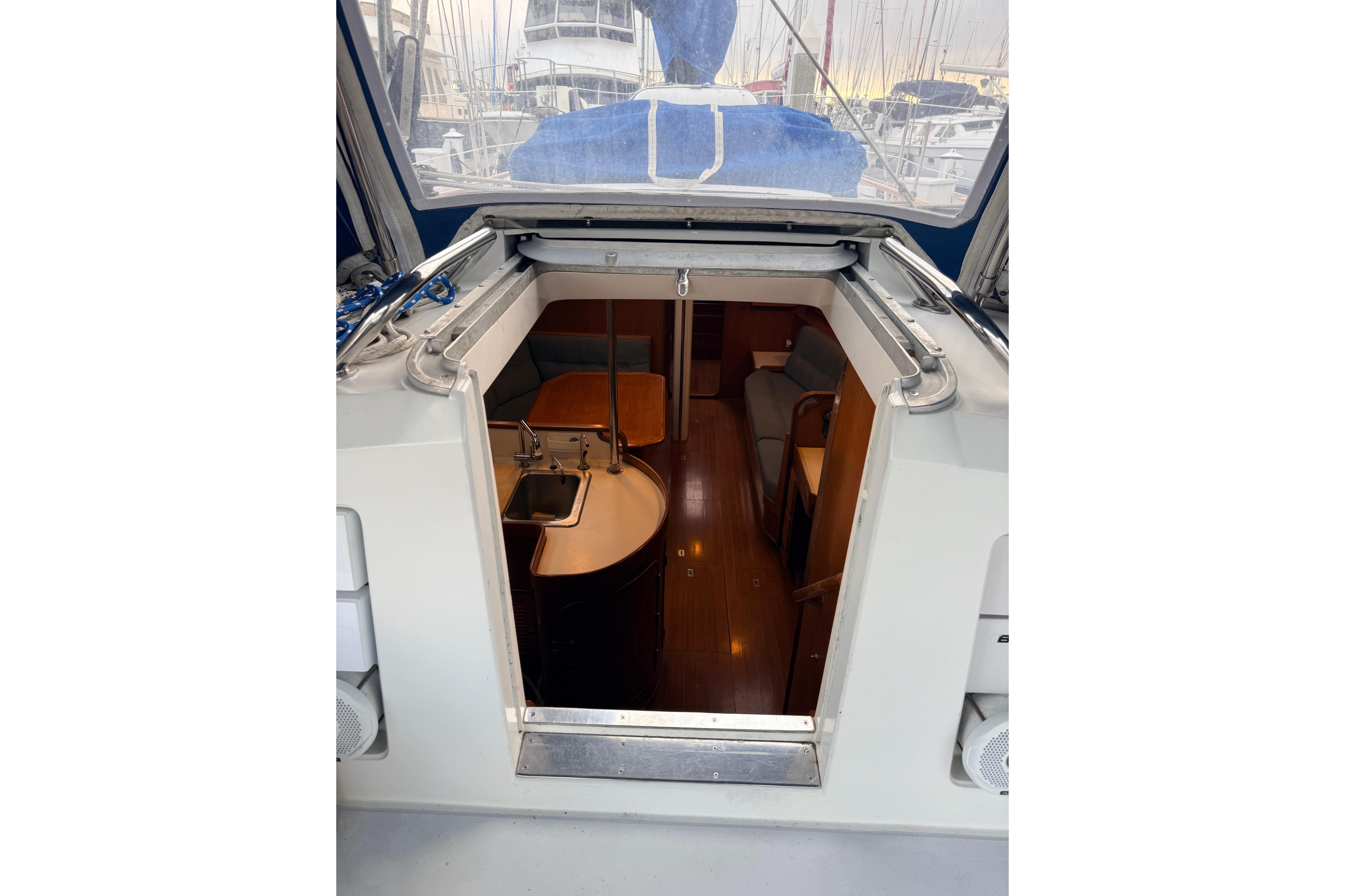 Interior view of 1987 Norseman 400 sailboat, showcasing cabin entrance and seating area.