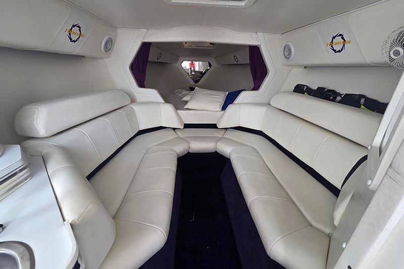 2004 Fountain 38 Lightning boat interior with white leather seating and modern design.