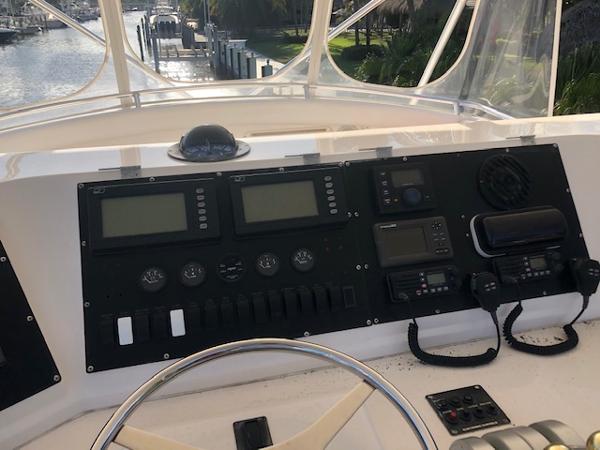 1997 Bertram Convertible boat dashboard with navigation instruments and controls.