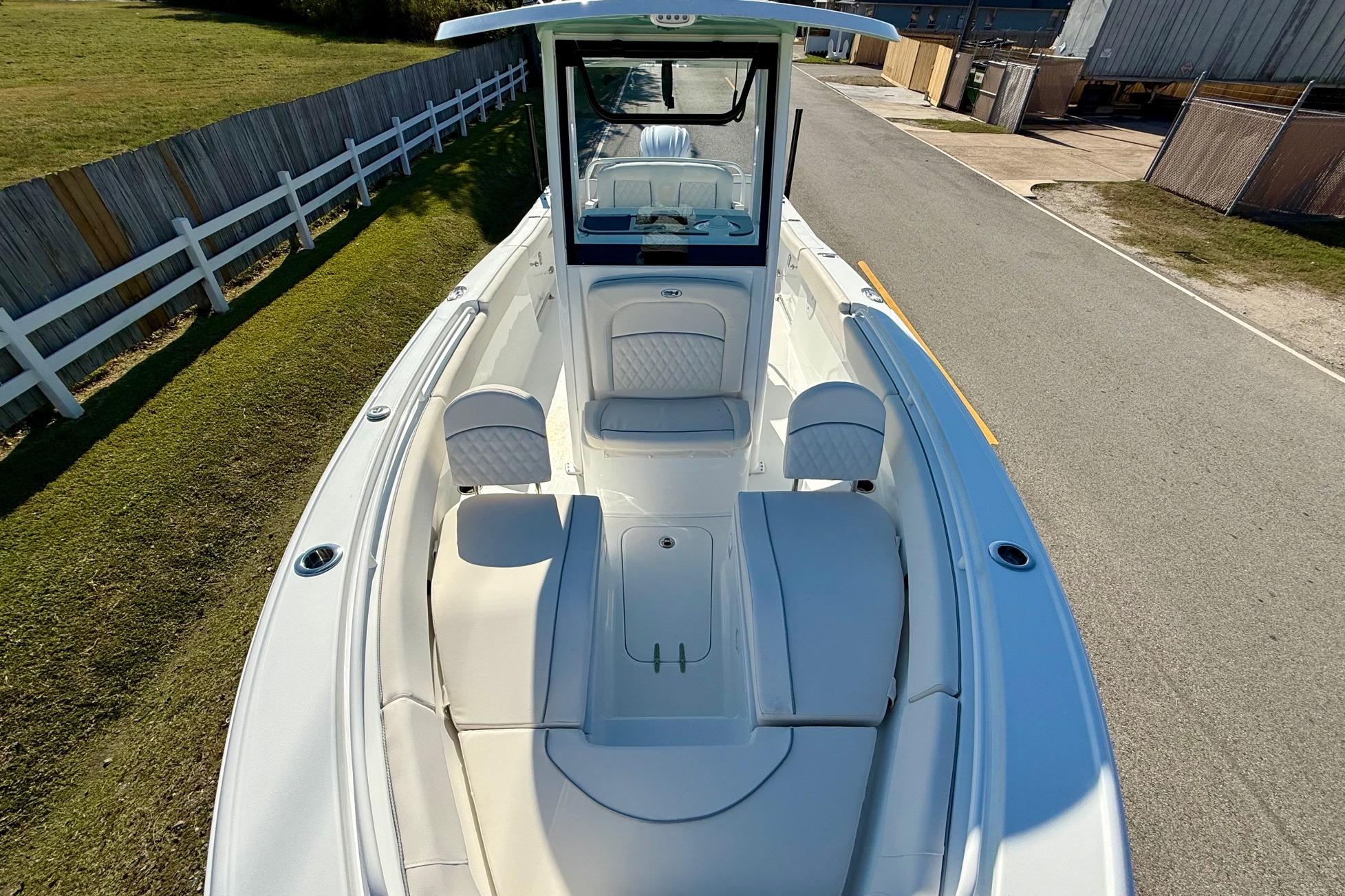 2026 Sea Hunt Ultra 255 SE boat, spacious deck, white seating, modern design.