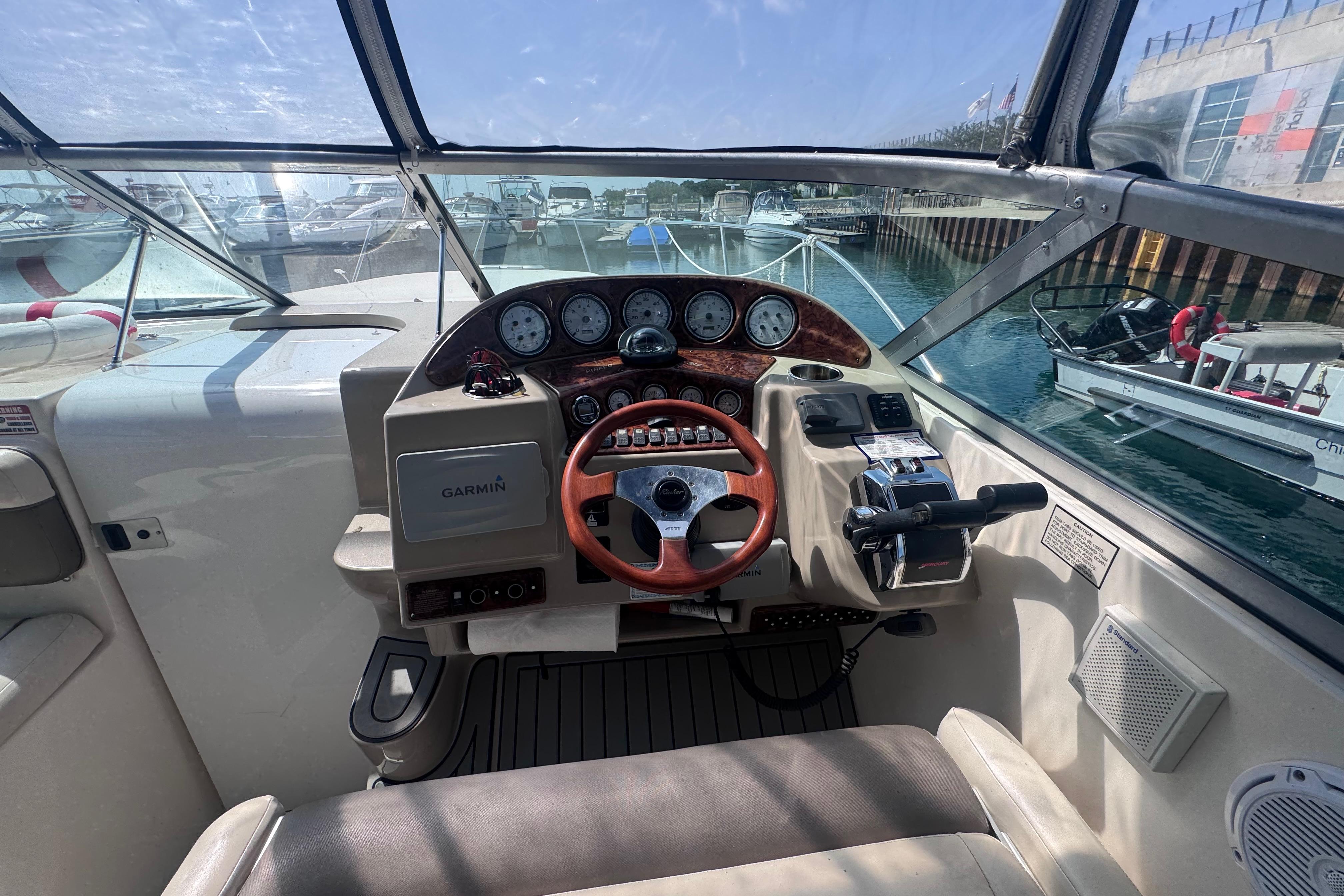 Cockpit view of 2003 Rinker Fiesta Vee 312 boat with Garmin navigation system.