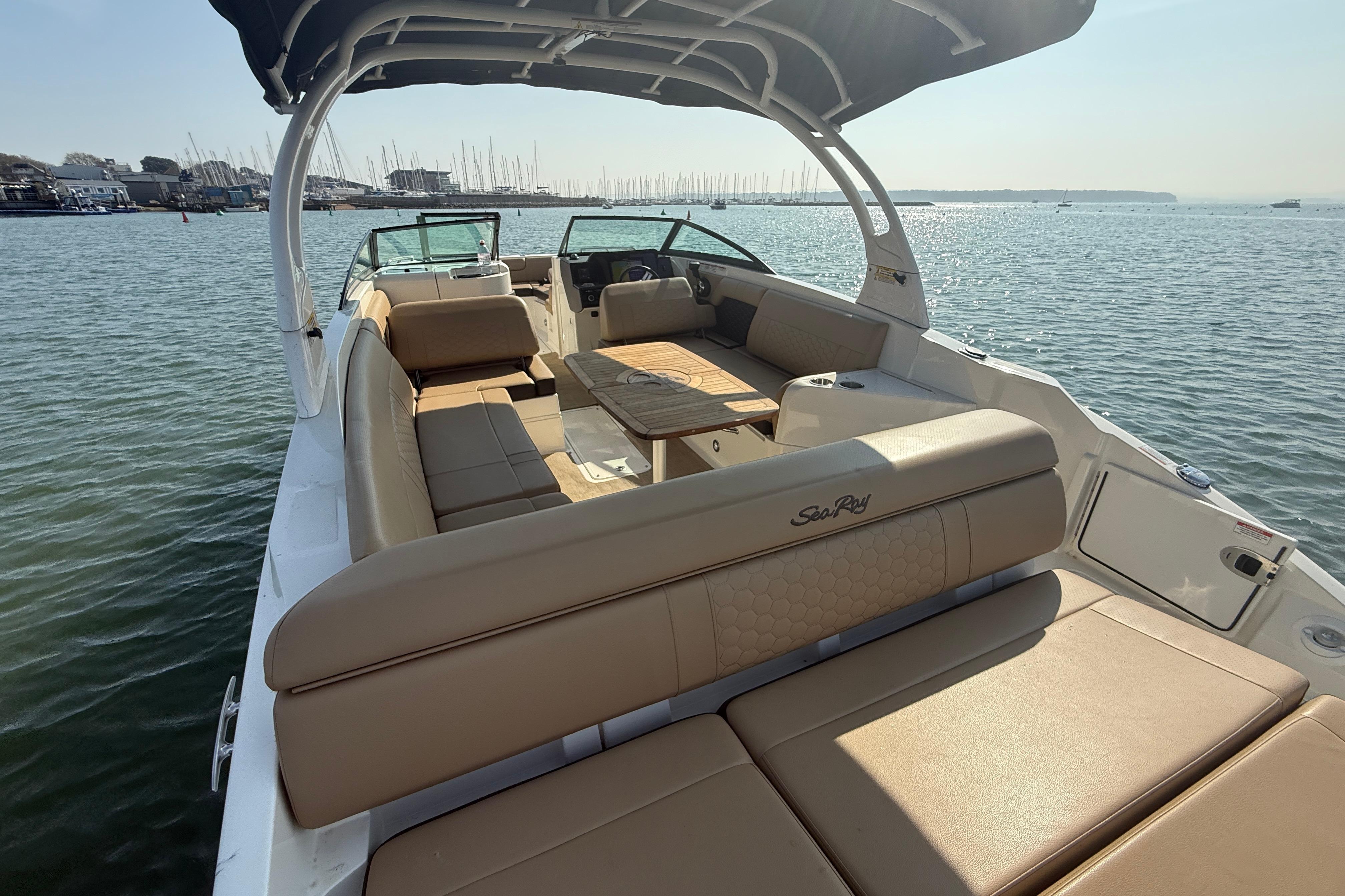2018 Sea Ray 270 SDX boat with spacious seating on calm water.