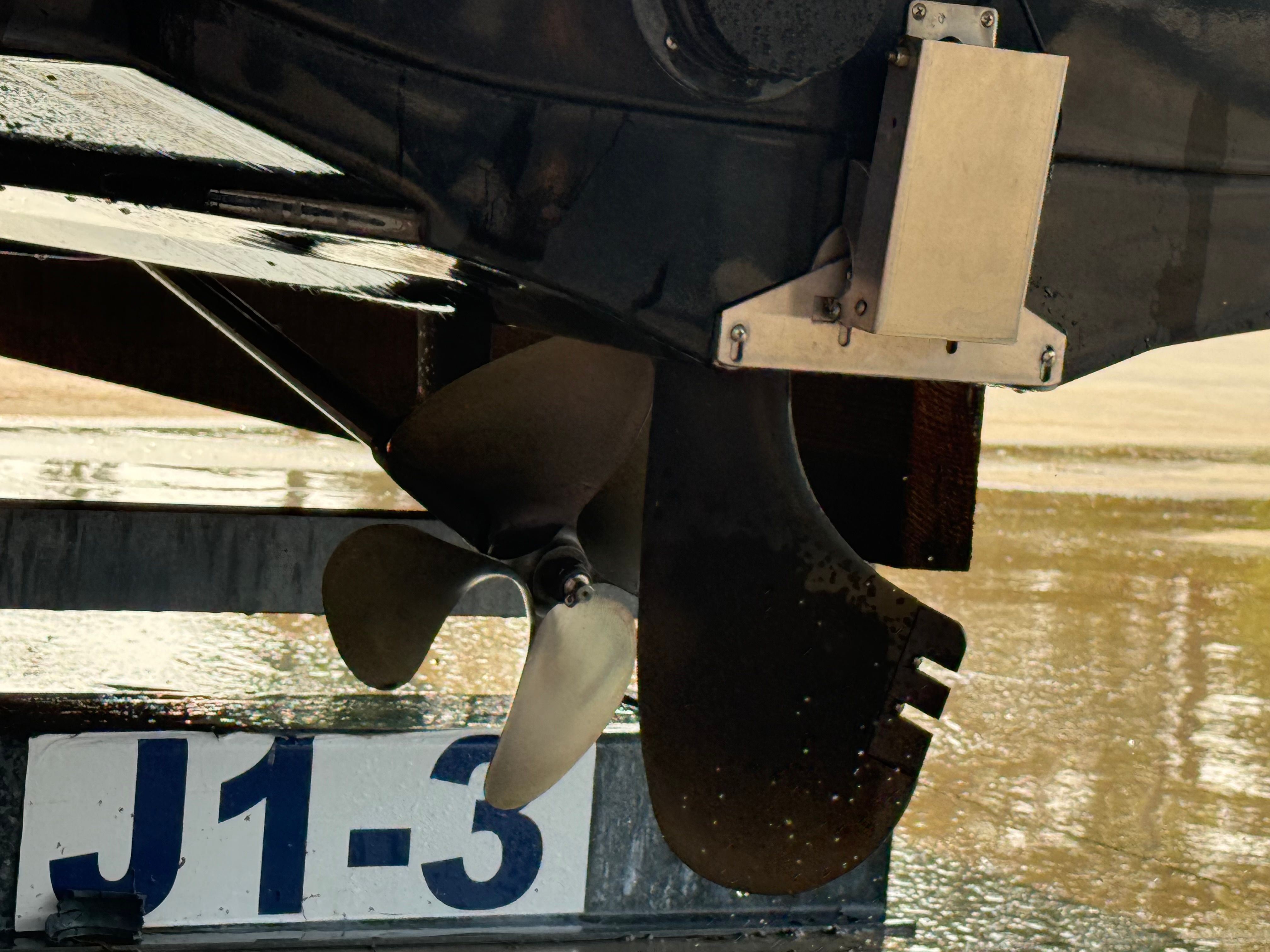 Close-up of a boat propeller on a trailer.