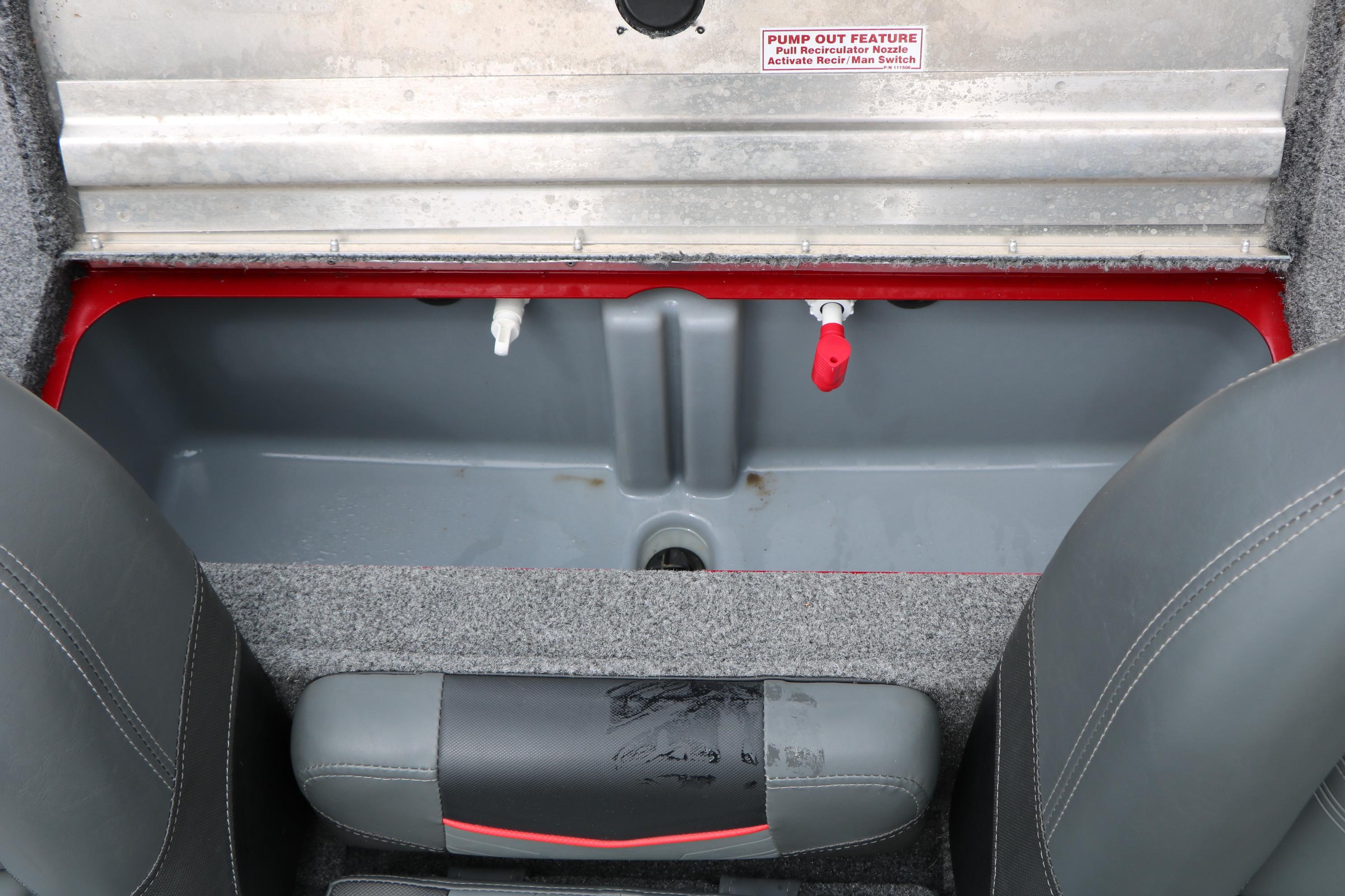 2024 Tracker Pro Team 175 boat interior storage compartment with pump-out feature.