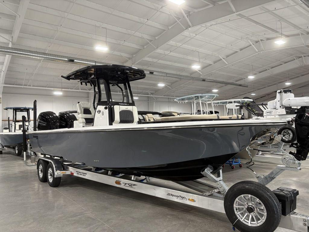 2026 Tidewater 2700 CB boat on trailer in indoor showroom.