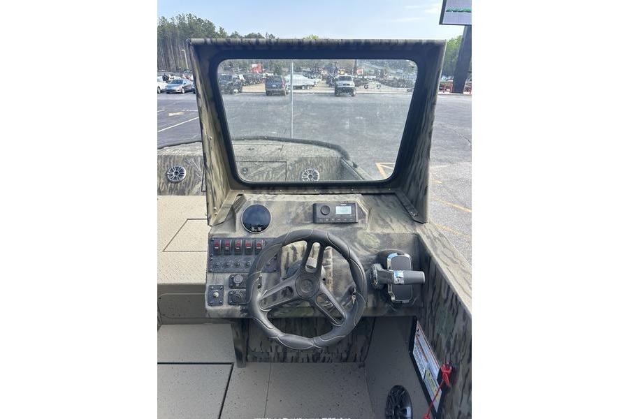 2025 SeaArk Predator 300 AK boat dashboard with steering wheel and controls.