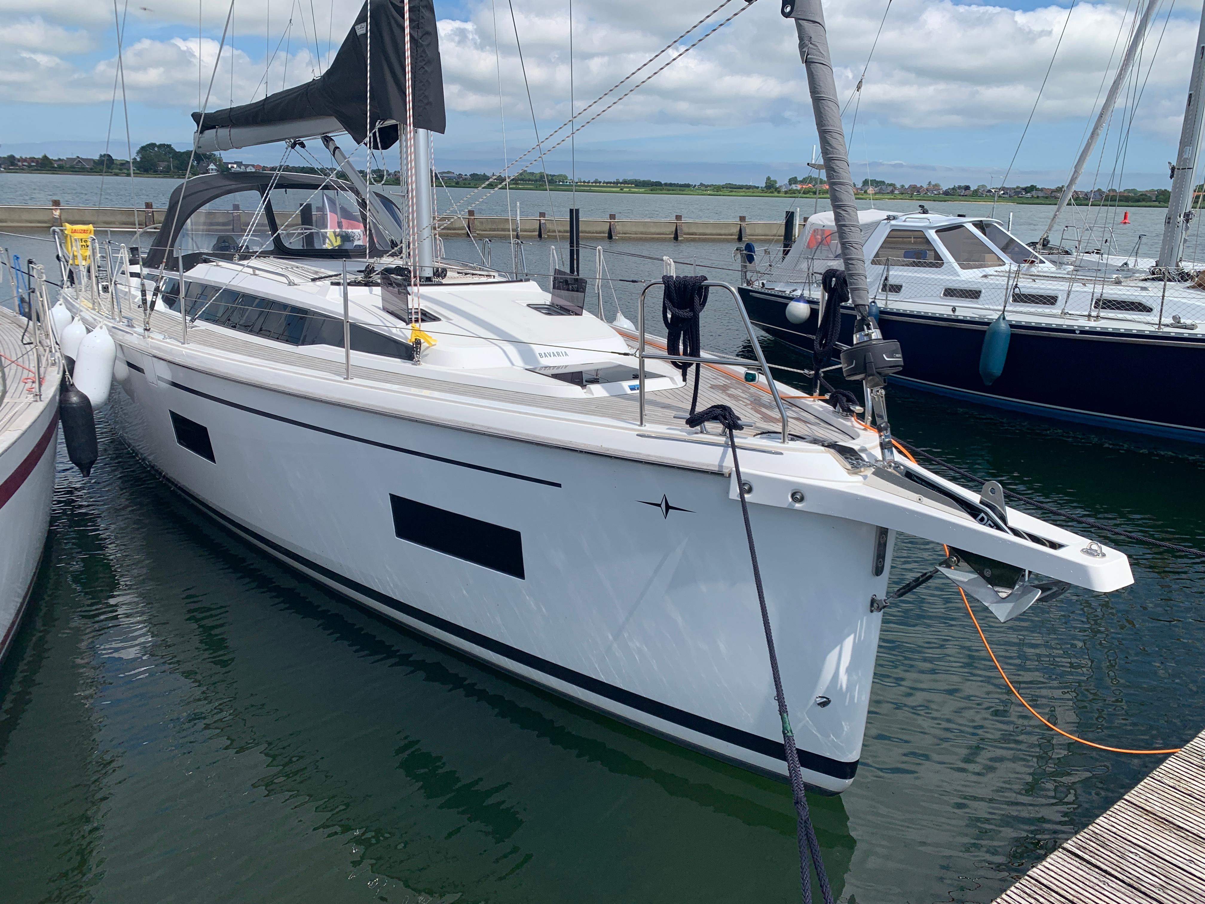 2021 Bavaria C38 sailboat docked at a marina, featuring sleek design and modern amenities.