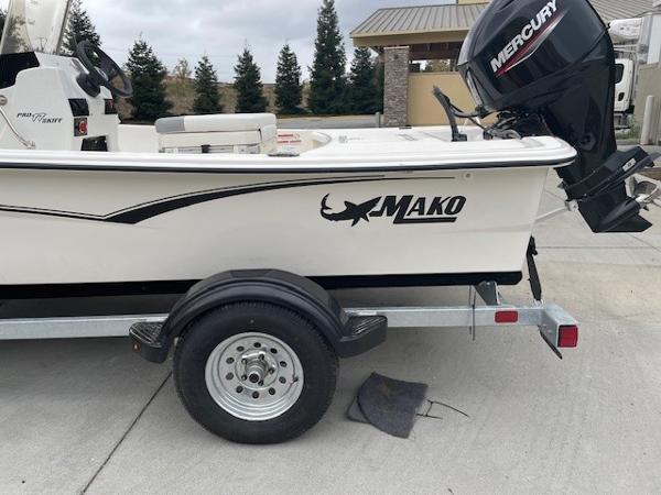 2025 Mako Pro Skiff 17 CC boat on trailer with Mercury outboard motor.