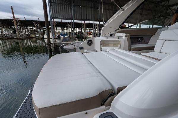 2016 Regal 28 Express boat with spacious seating at a marina dock.