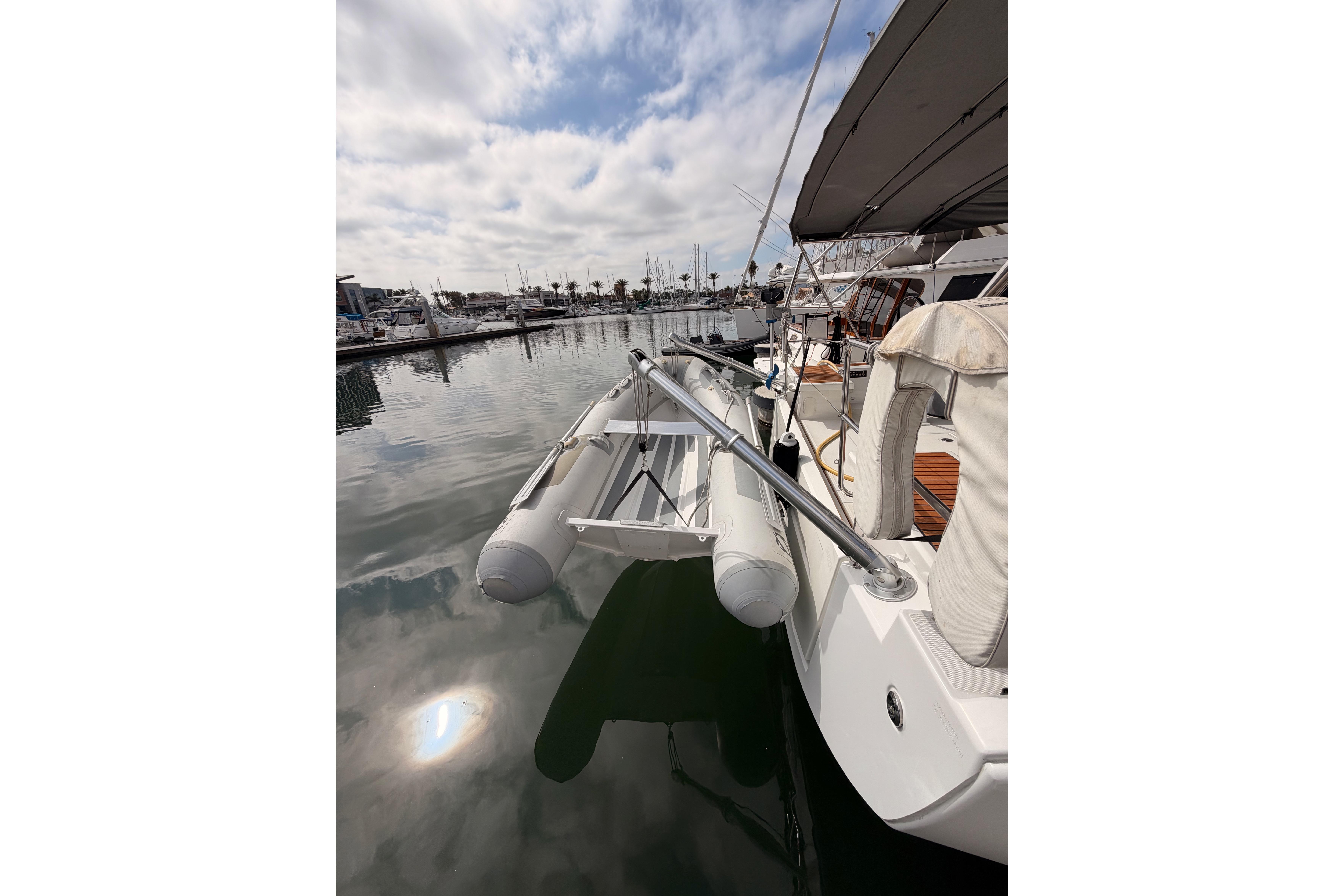 Beneteau Oceanis 46.1 yacht, 2020 model, docked with inflatable dinghy attached.