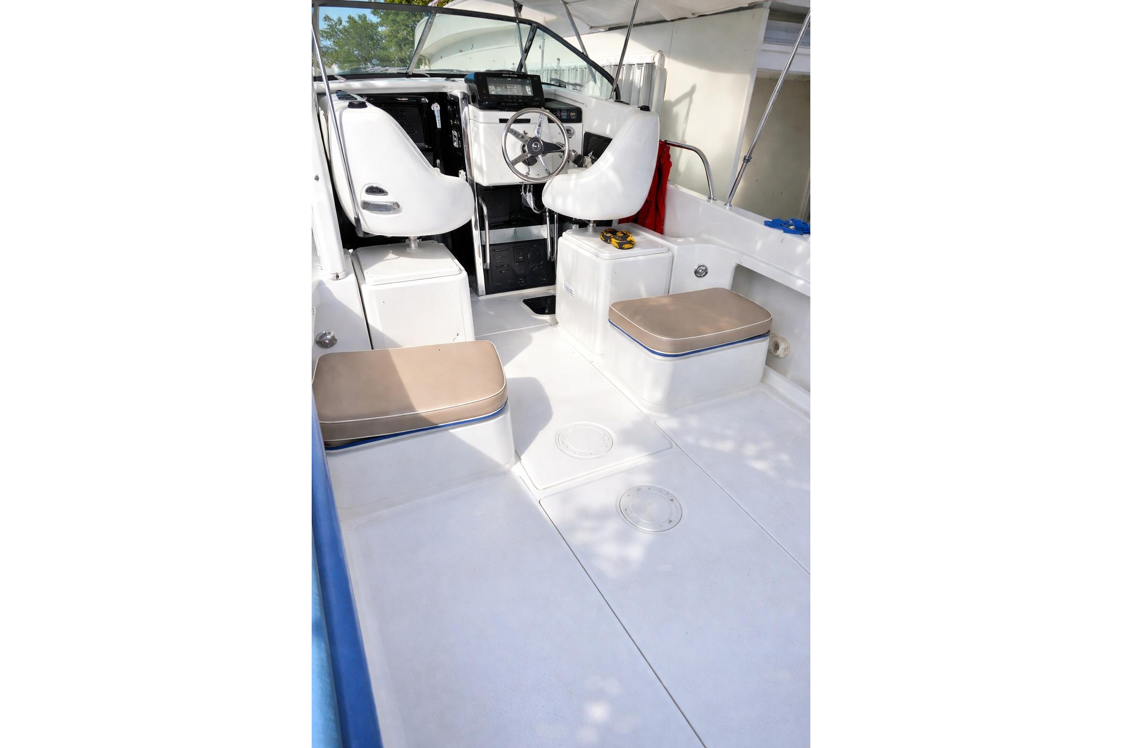 1989 Grady-White Offshore 242 boat interior with seating and steering wheel.