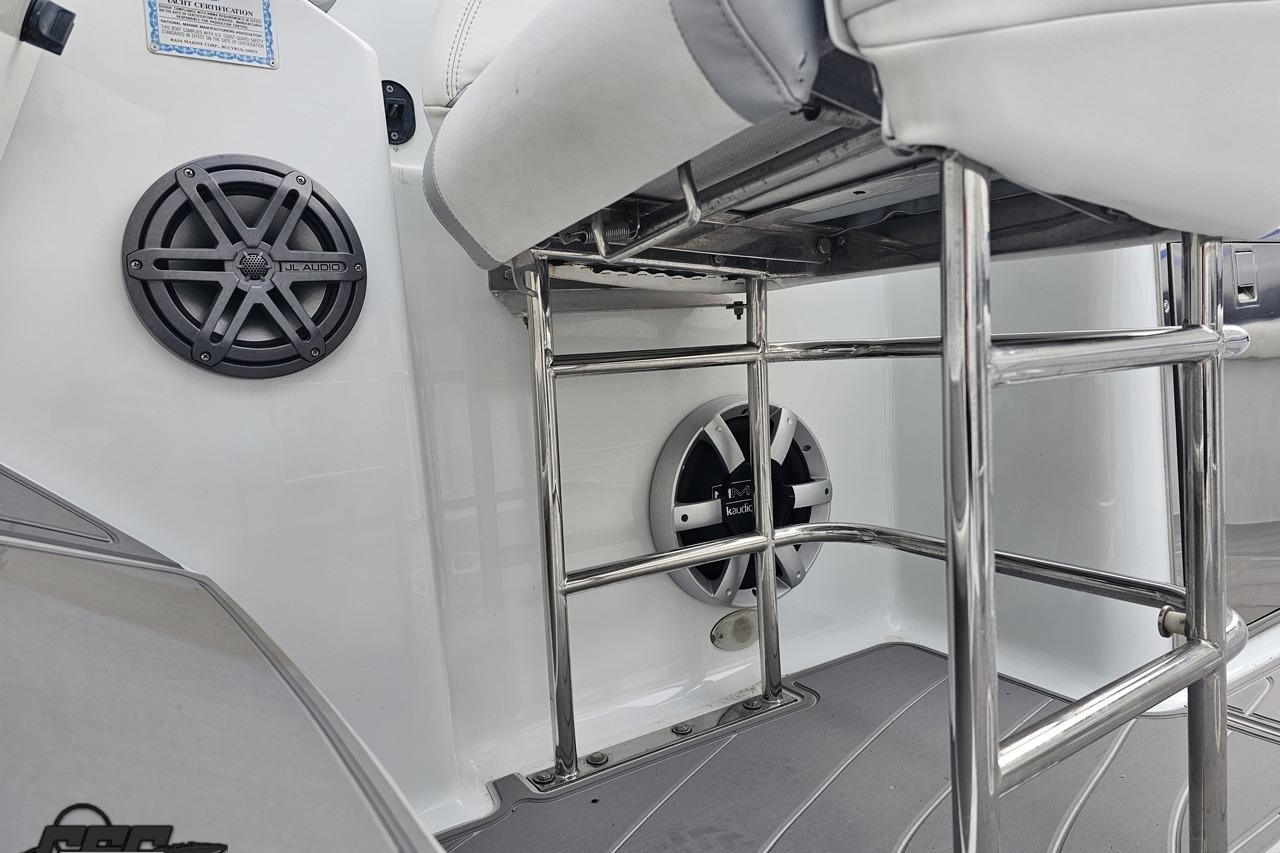 2008 Baja 335 Performance boat interior with JL Audio speakers and stainless steel railings.