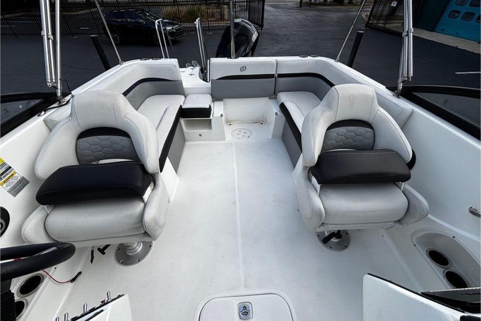 2022 Hurricane SunDeck 217 OB boat interior with white seating and black accents.